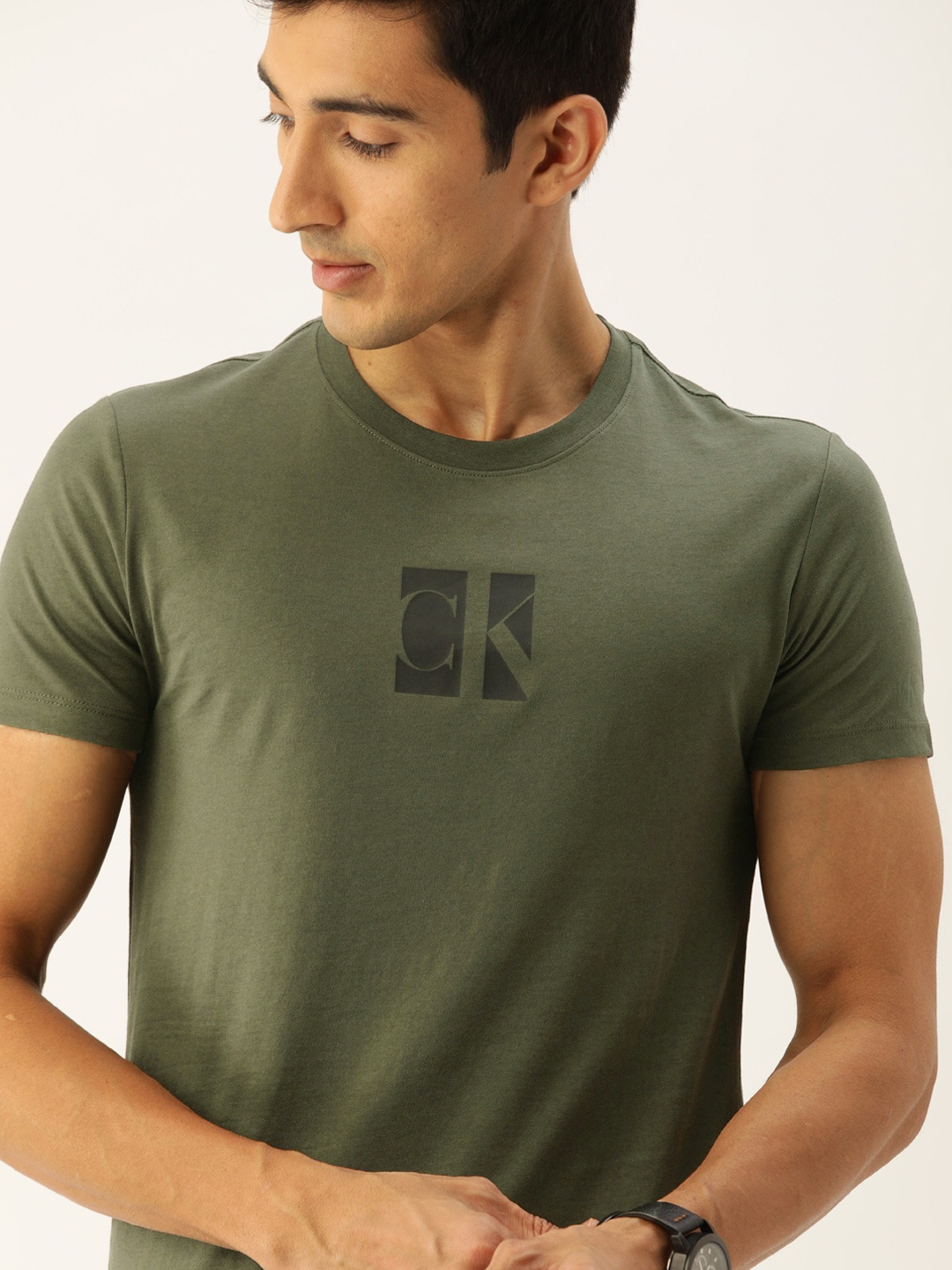 

Calvin Klein Jeans Men Olive Green Solid Round Neck Organic Cotton T-shirt