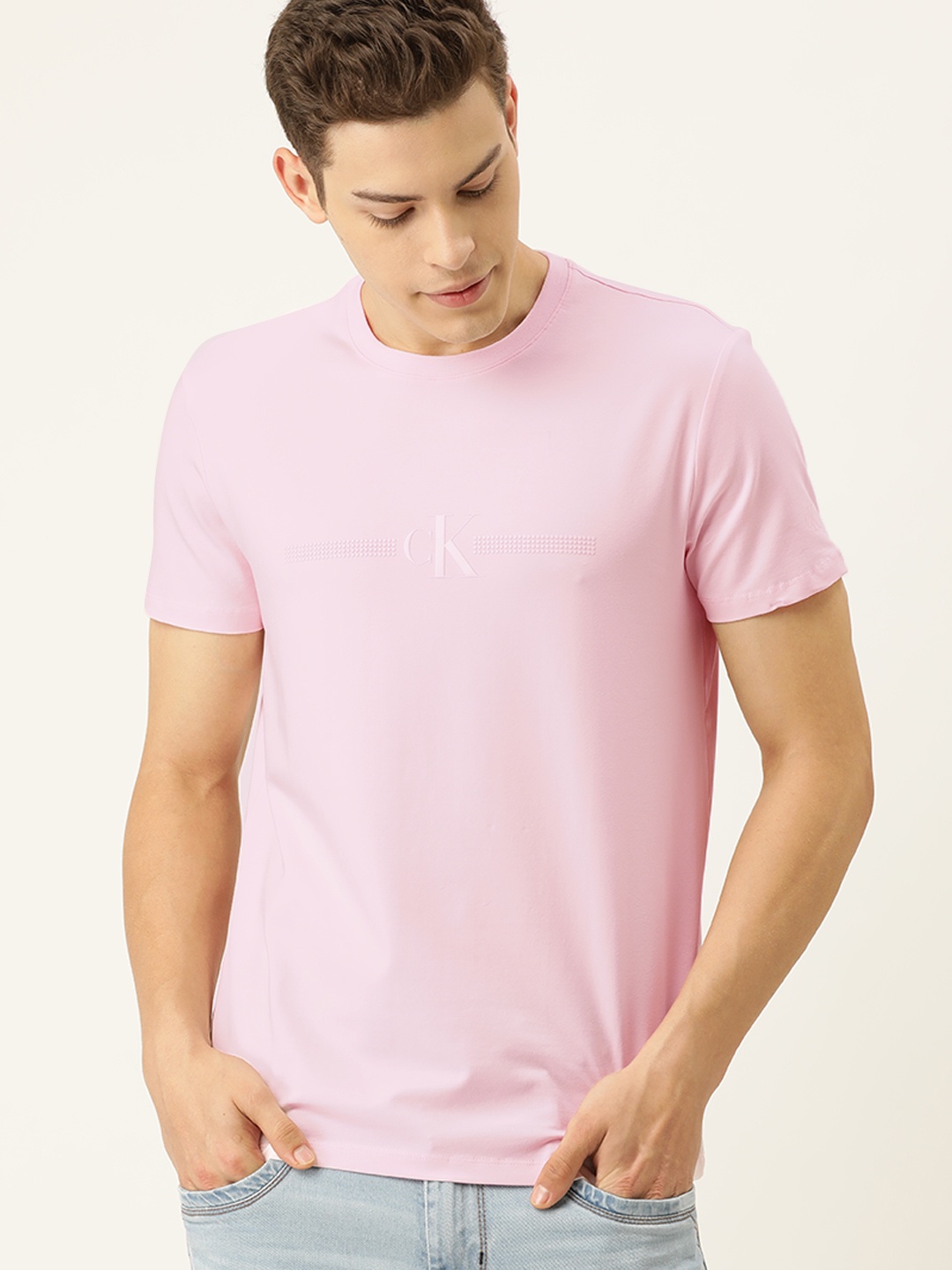 

Calvin Klein Jeans Men Pink Solid Round Neck T-shirt With Printed Detailing