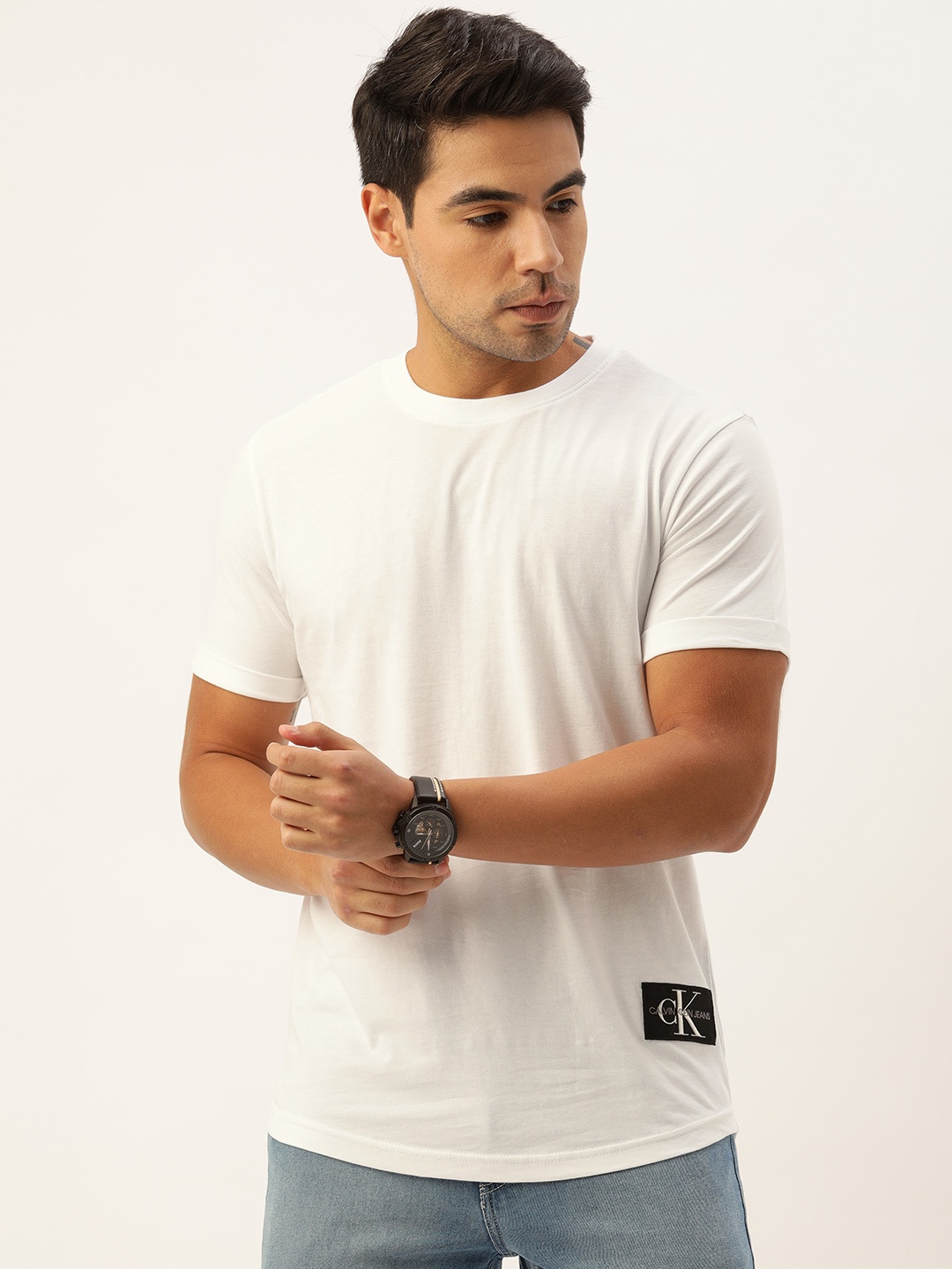 

Calvin Klein Jeans Men White Solid Round Neck Pure Cotton T-shirt