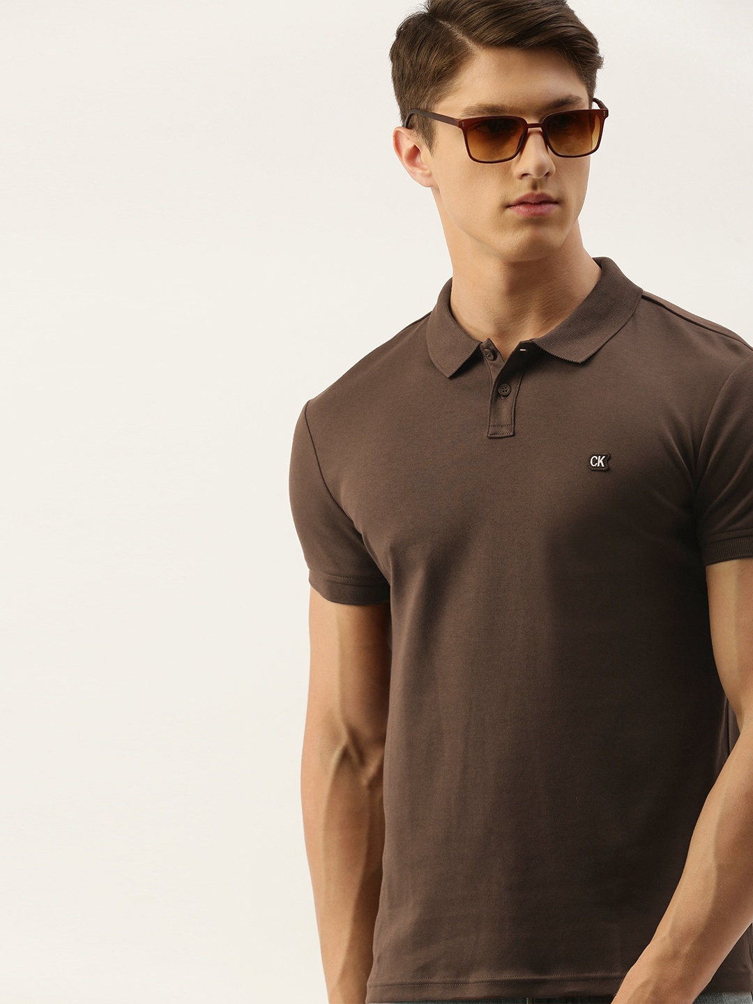 

Calvin Klein Jeans Men Brown Solid Polo Collar Pure Cotton T-shirt
