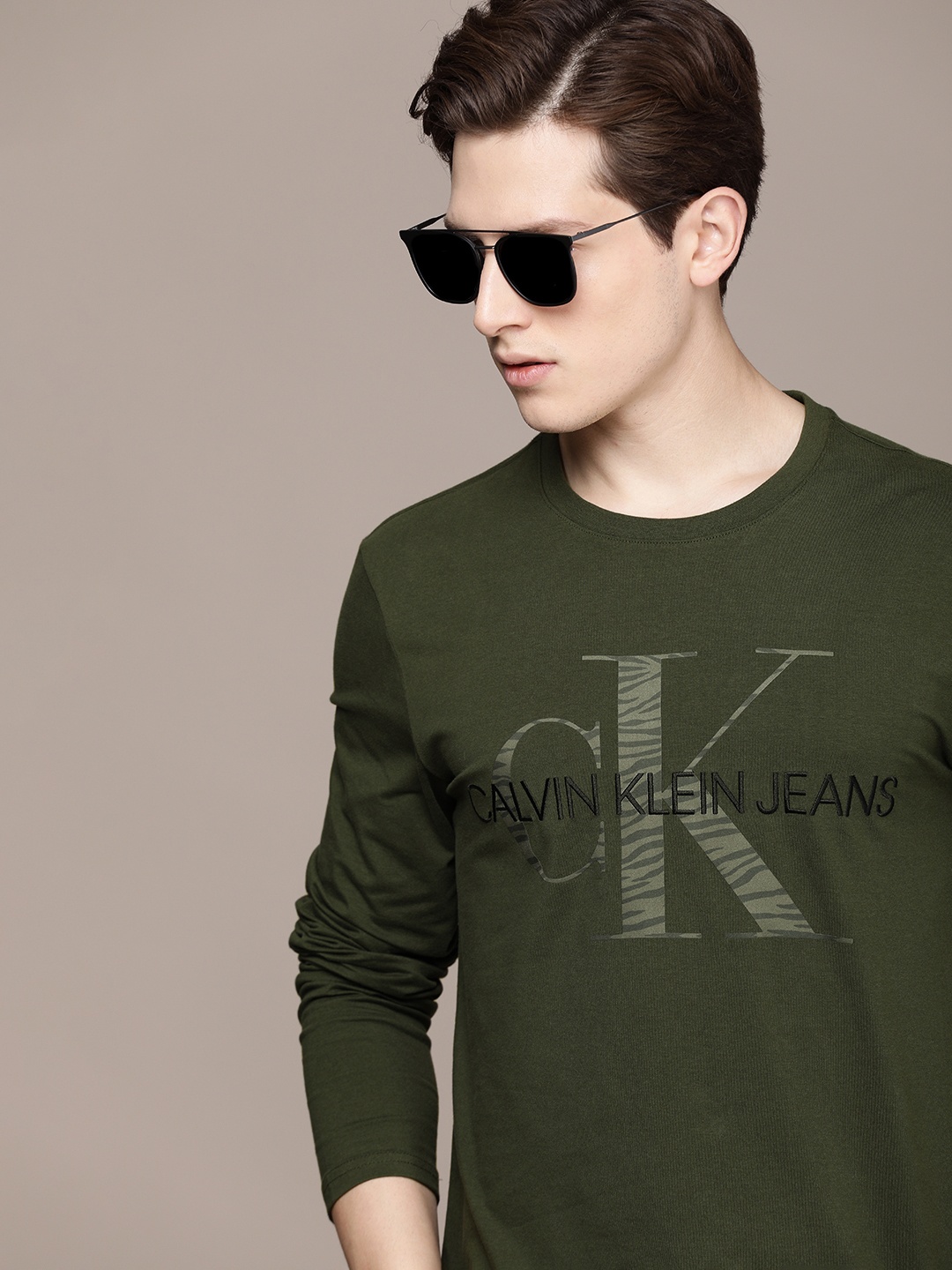 

Calvin Klein Jeans Men Olive Green Brand Logo Printed Slim Fit T-shirt