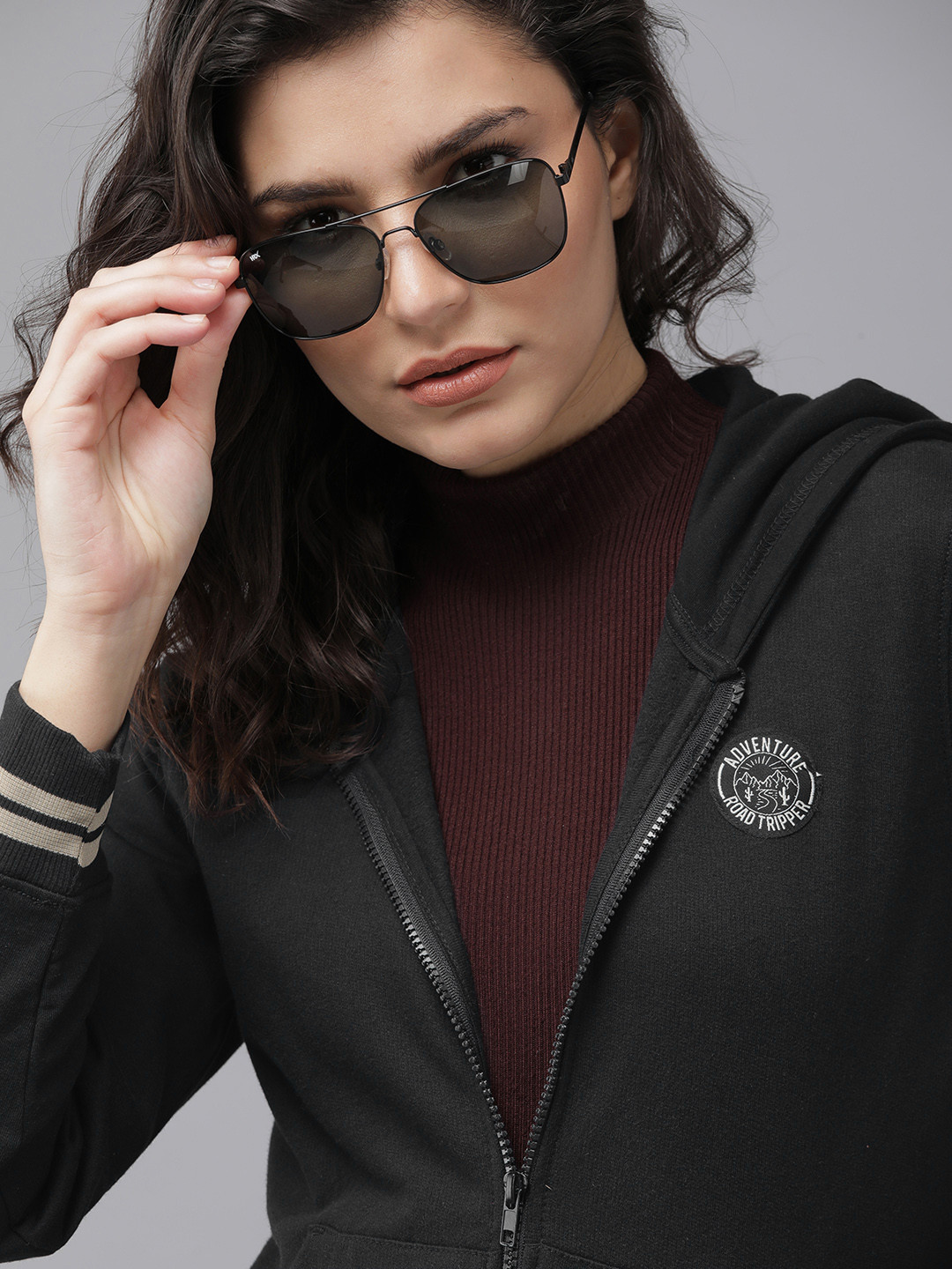 

Roadster Women Black Solid Hooded Sweatshirt