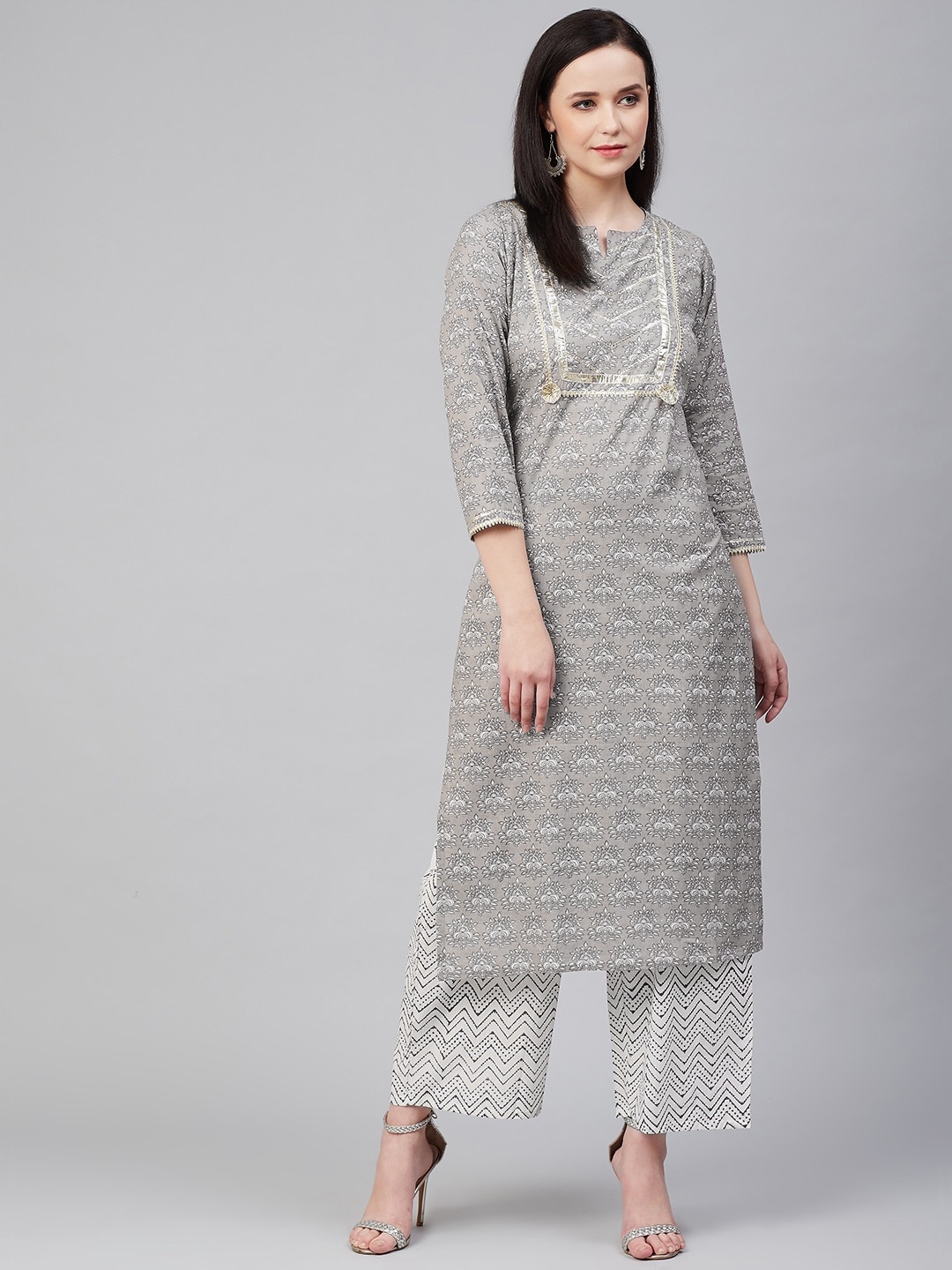 

Bhama Couture Women Grey & White Printed Kurta with Palazzos