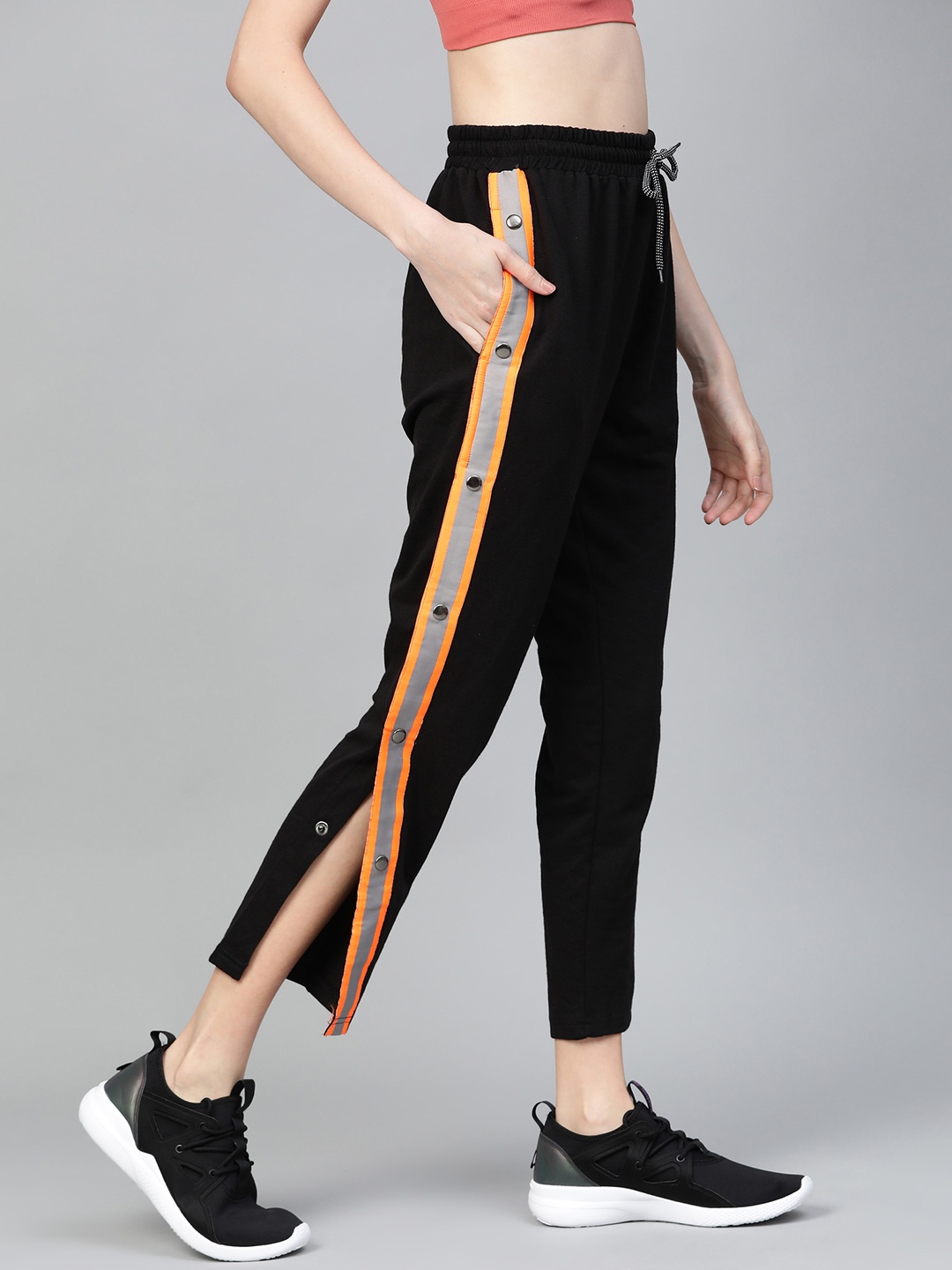 

Hubberholme Women Black Slim Fit Solid Side Taping Cropped Track Pants