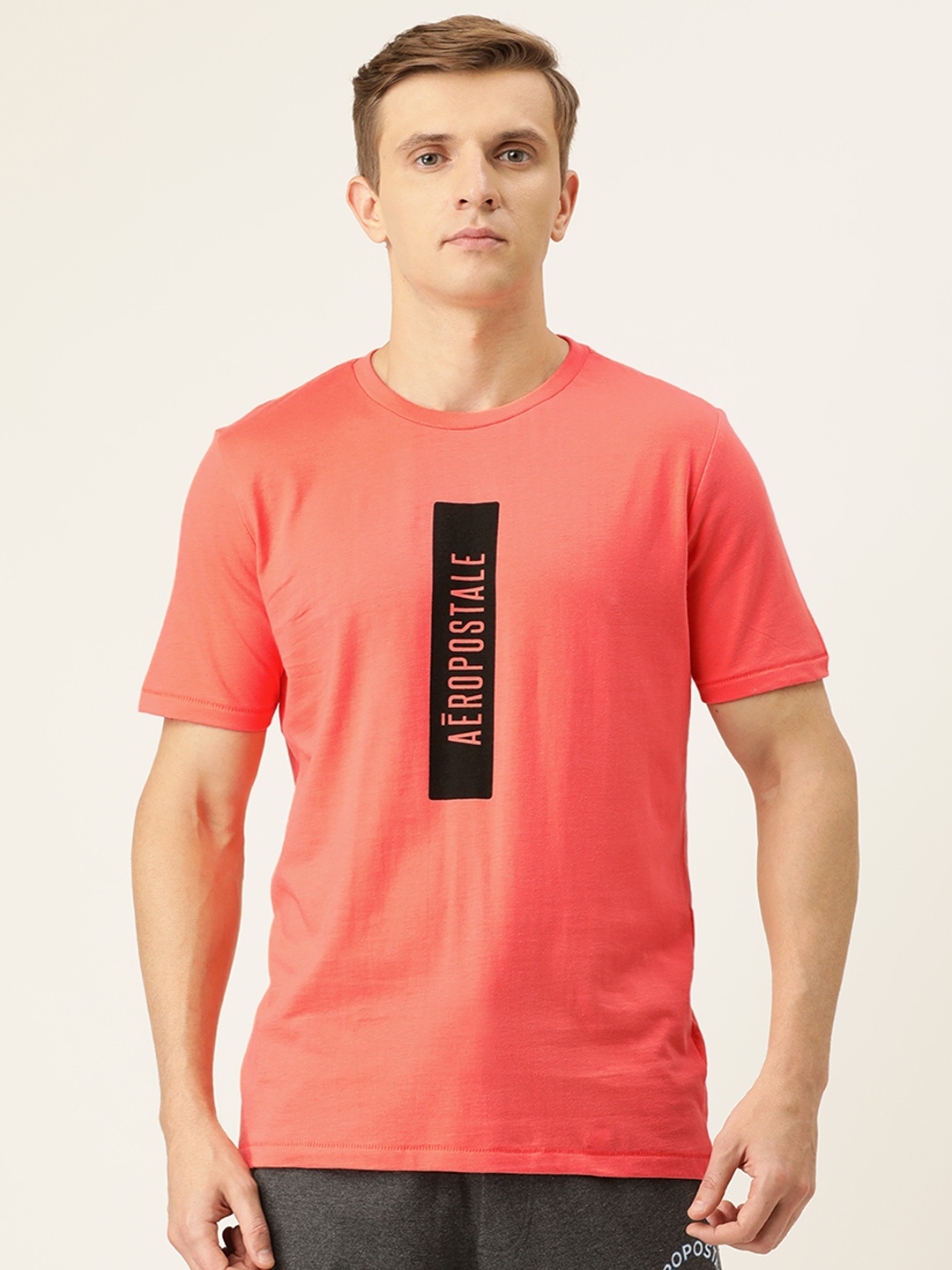 

Aeropostale Men Coral Orange Black Printed Round Neck Pure Cotton T-shirt