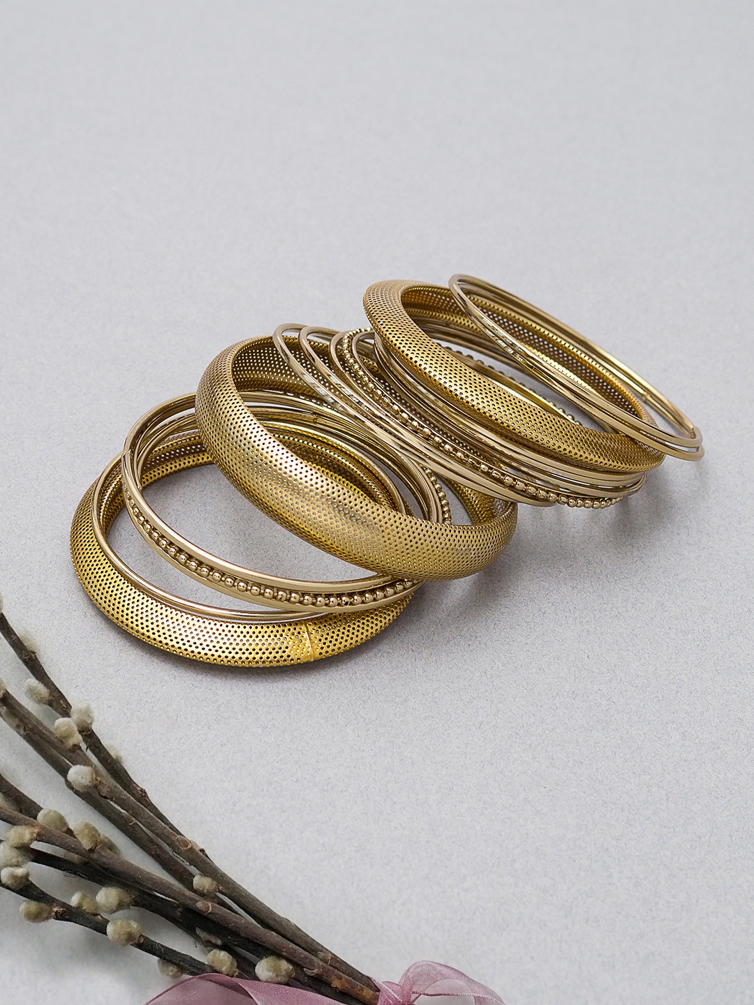 

Golden Peacock Set of 17 Alloy Gold-Toned Antique Bangles