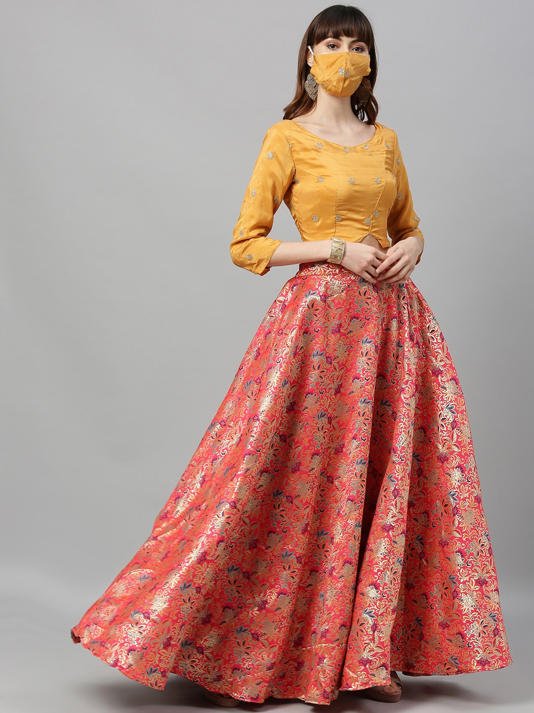 

Ethnovog Mustard Yellow Pink Made to Measure Lehenga with Blouse Mask