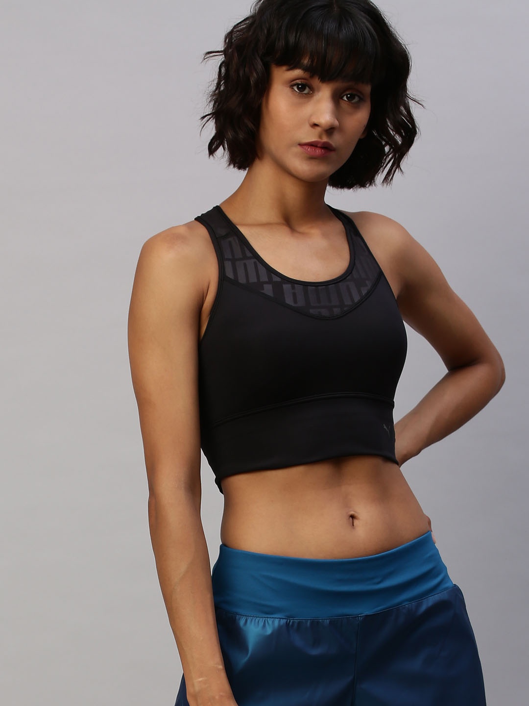 

Puma Black Solid Mid Impact First Mile dryCELL Non-Wired Lightly Padded Sports Bra