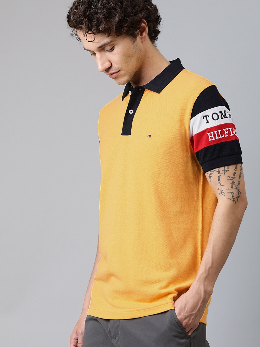 

Tommy Hilfiger Men Yellow Solid Polo Collar Pure Cotton T-shirt