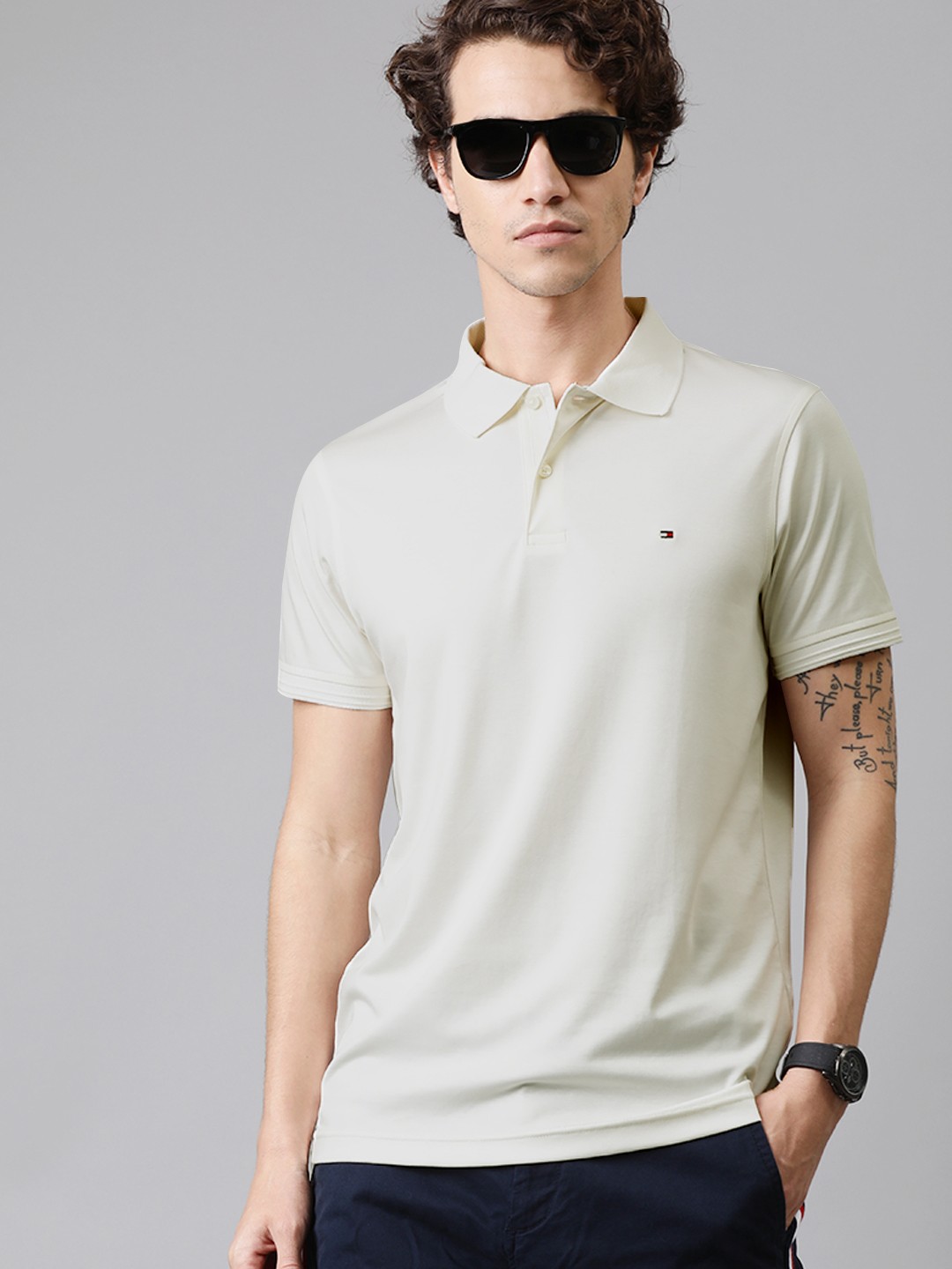 

Tommy Hilfiger Men Off-White Solid Polo Collar Pure Cotton T-shirt