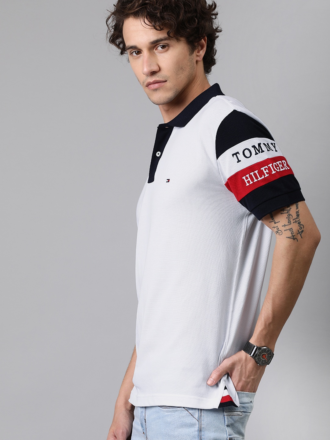 

Tommy Hilfiger Men White Solid Polo Collar Pure Cotton T-shirt With Colourblock Sleeves