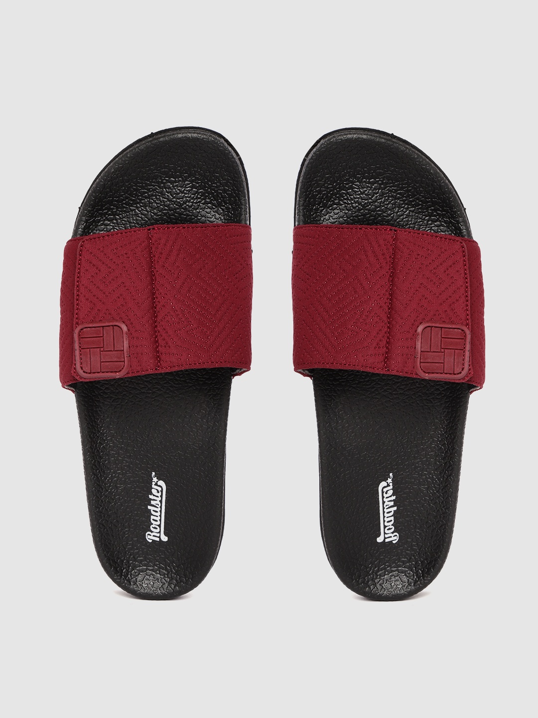 

Roadster Women Maroon & Black Self Design Sliders