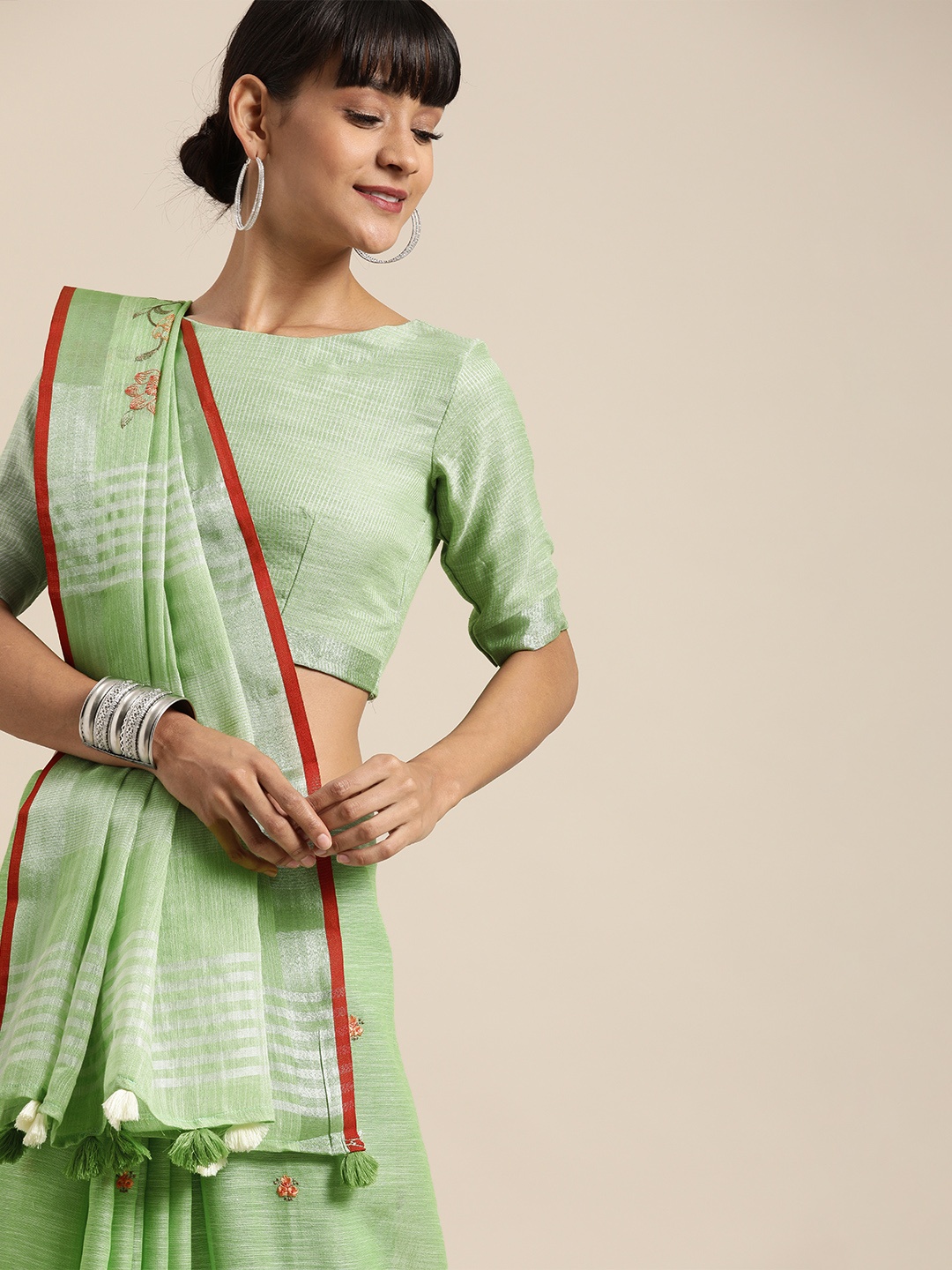 

Inddus Green Embroidered Linen Blend Saree