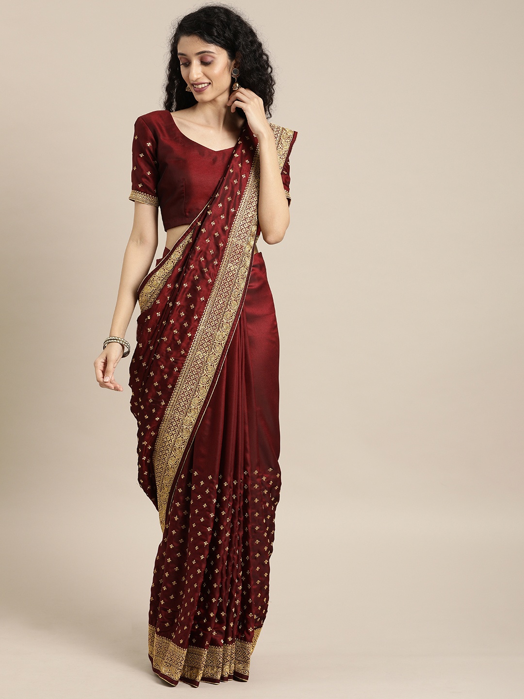 

Inddus Maroon & Gold-Toned Silk Blend Embroidered Saree