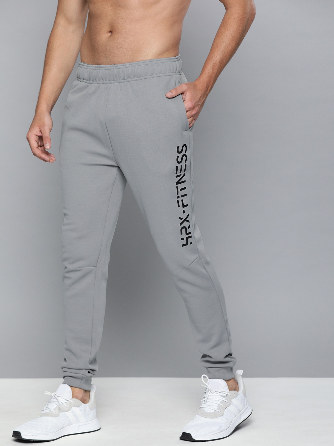 

HRX by Hrithik Roshan Men Wet Weather Solid Regular Fit Rapid-Dry Training Joggers, Grey melange