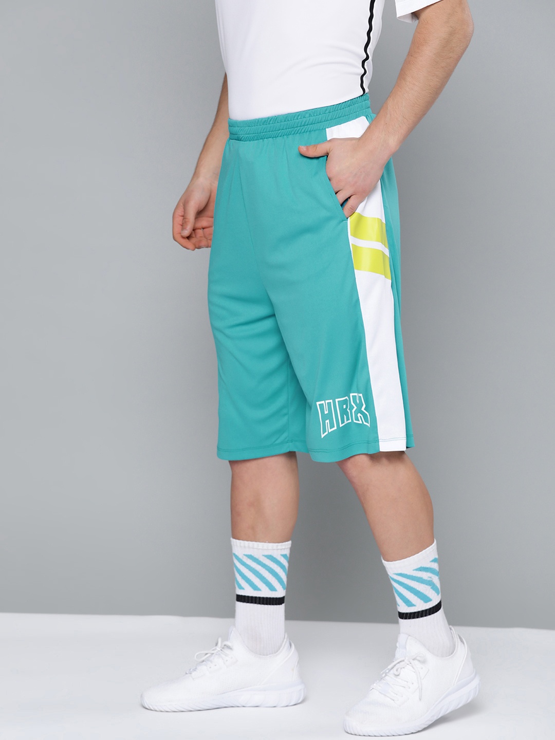 

HRX by Hrithik Roshan Men Peacock Blue Solid Regular Fit Rapid-Dry Basketball Shorts