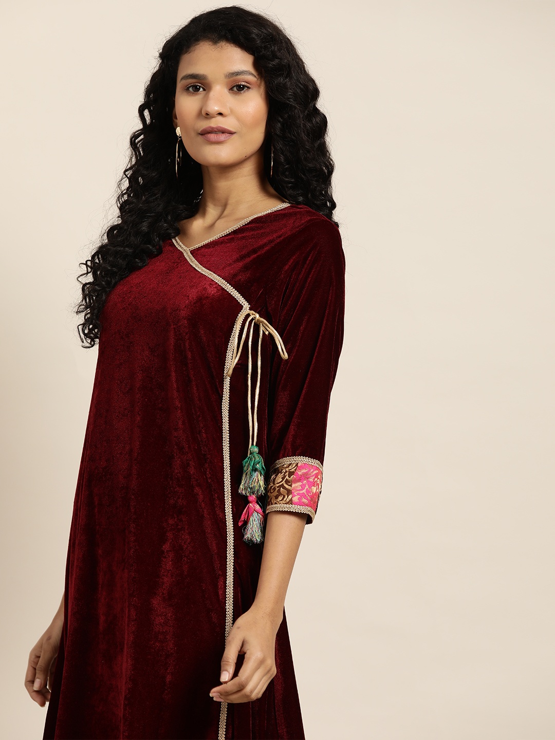 

Sangria Women Maroon & Beige Velvet Finish Solid Kurta with Trousers