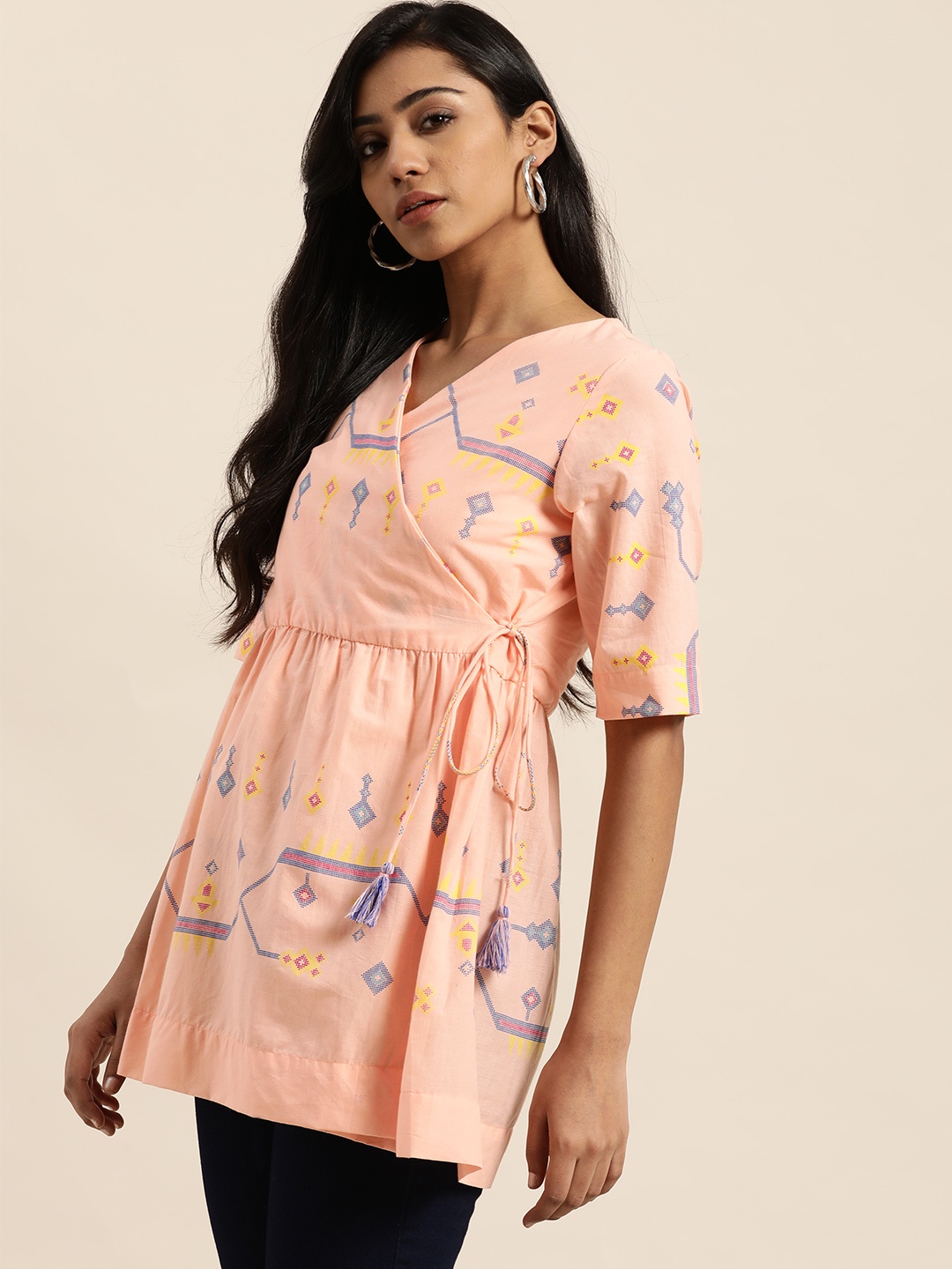 

Sangria Women Peach-Coloured & Blue Ethnic Print Cotton Gathered Wrap Longline Top