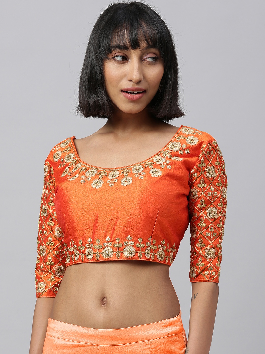 

Amrutam Fab Women Orange & Gold-Toned Embroidered Saree Blouse