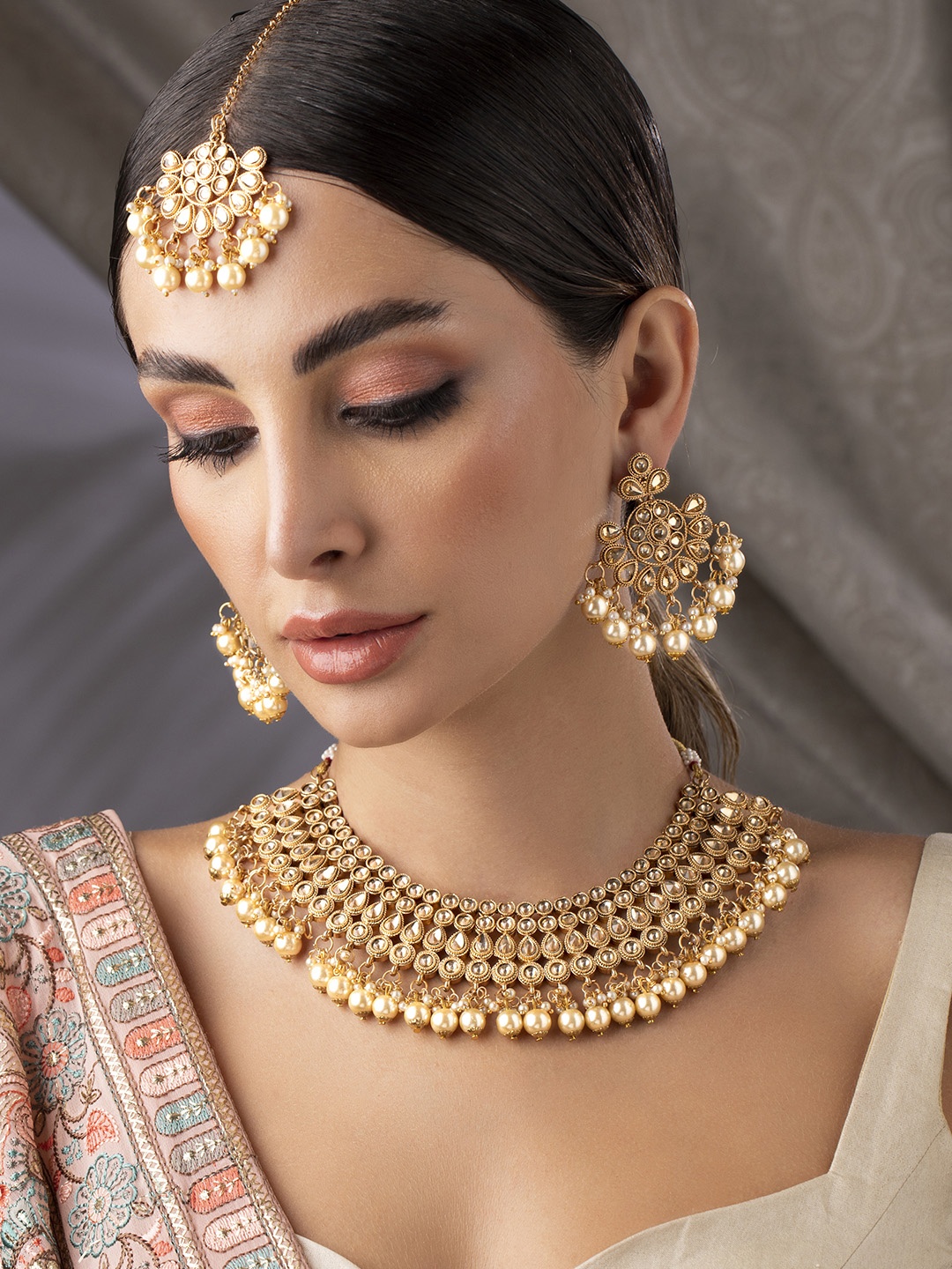 

Rubans 22 K Gold-Plated Beige Kundan-Studded Pearl Handcrafted Jewellery Set
