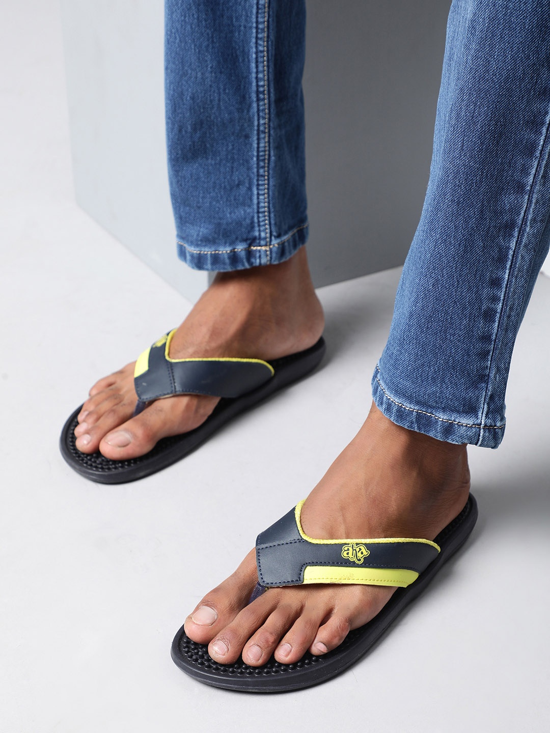 

Liberty Men Navy Blue & Yellow Solid Thong Flip-Flops