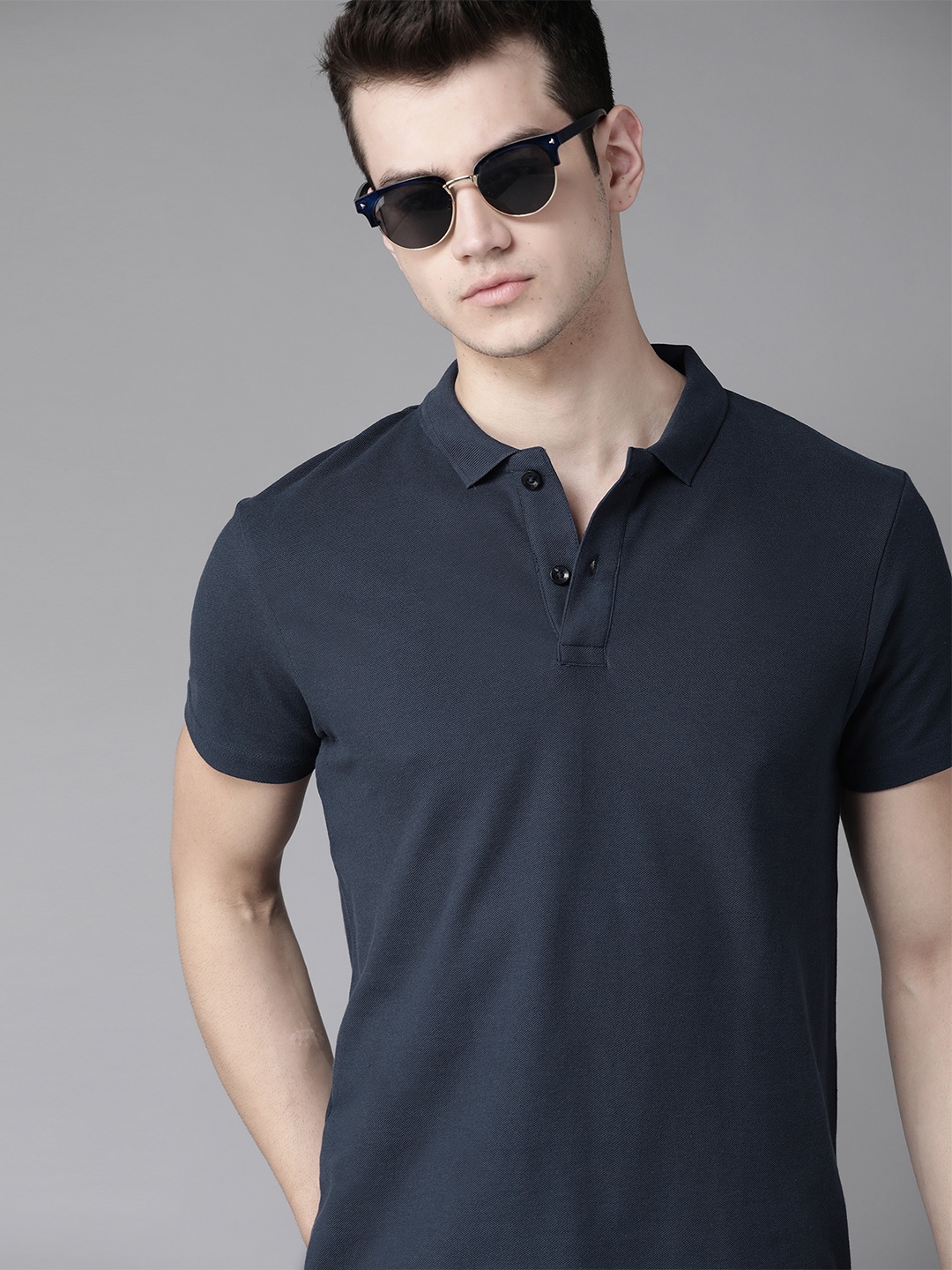 

Roadster Men Navy Blue Solid Polo Collar T-shirt