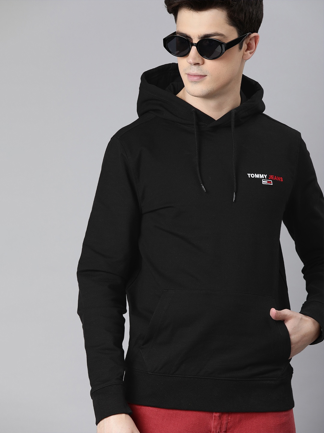 

Tommy Hilfiger Men Black Solid Hooded Sweatshirt