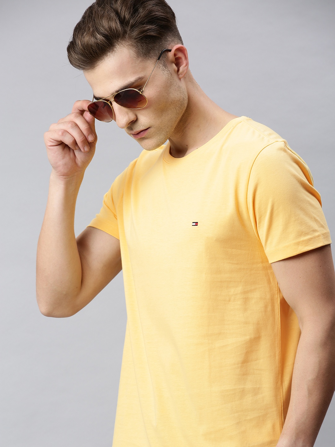 

Tommy Hilfiger Men Orange Solid Round Neck T-shirt