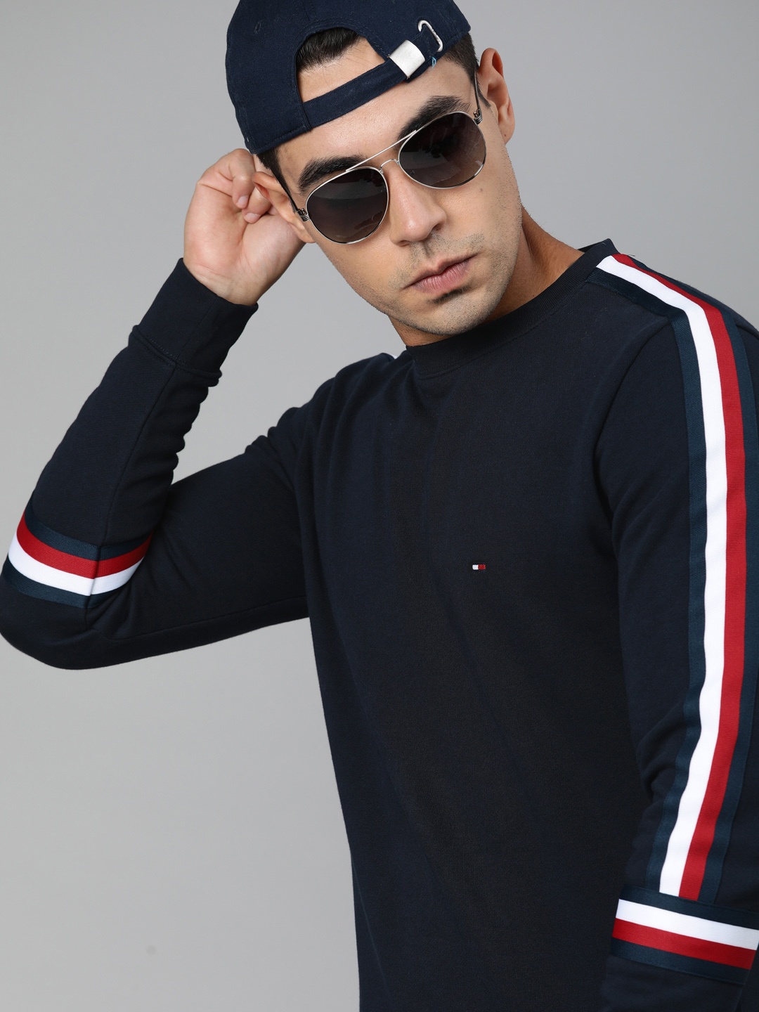 

Tommy Hilfiger Men Navy Blue Solid Sweatshirt with Striped Tape Detailing Sleeve