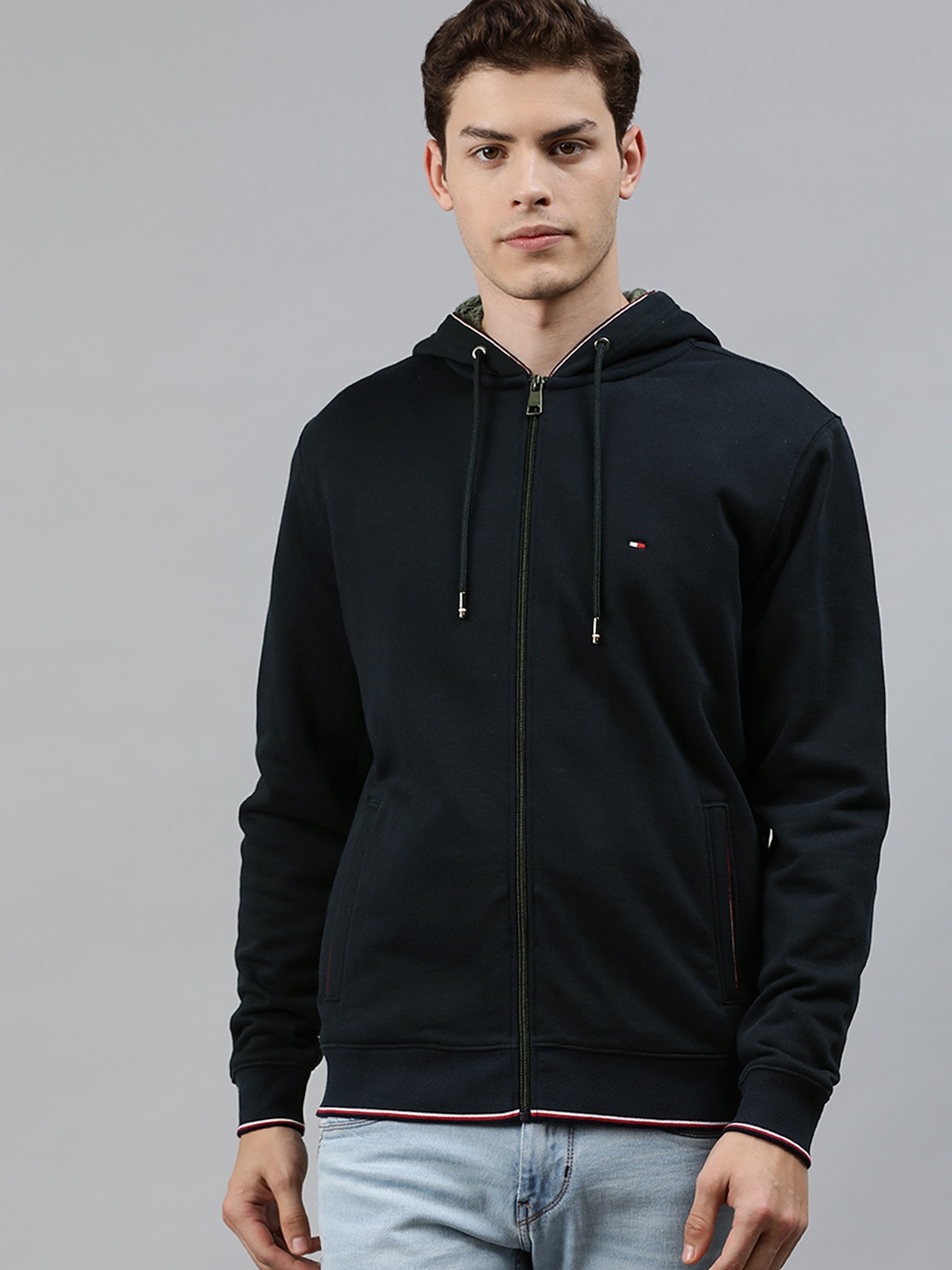 

Tommy Hilfiger Men Navy Blue Solid Hooded Sweatshirt