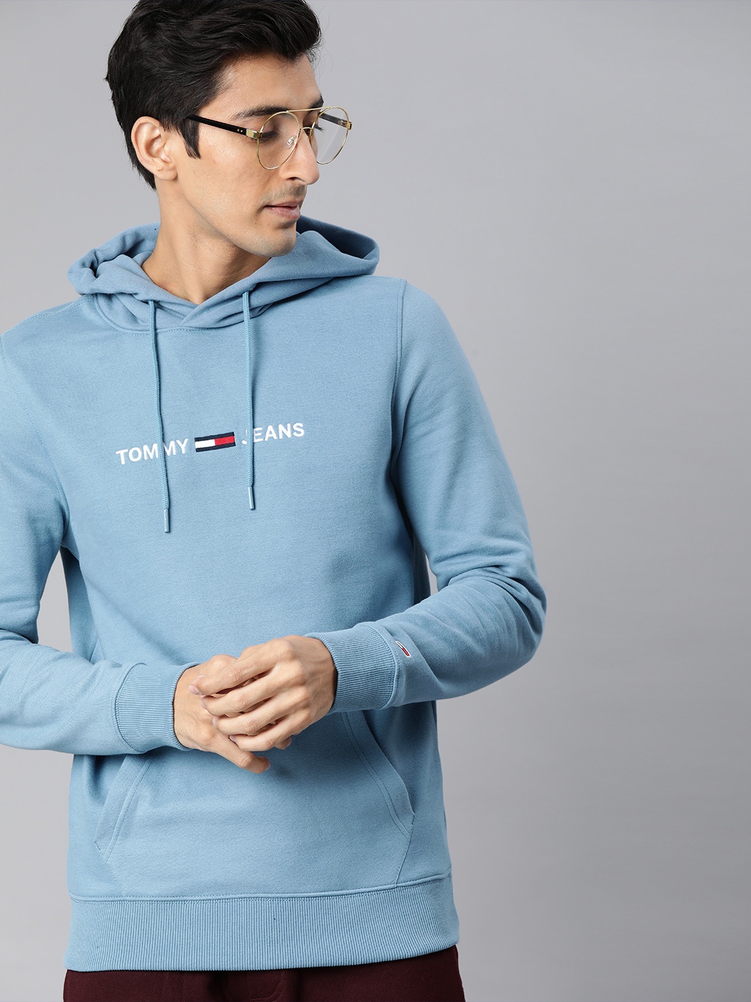 

Tommy Hilfiger Men Blue Solid Hooded Sweatshirt with Embroidered Detail