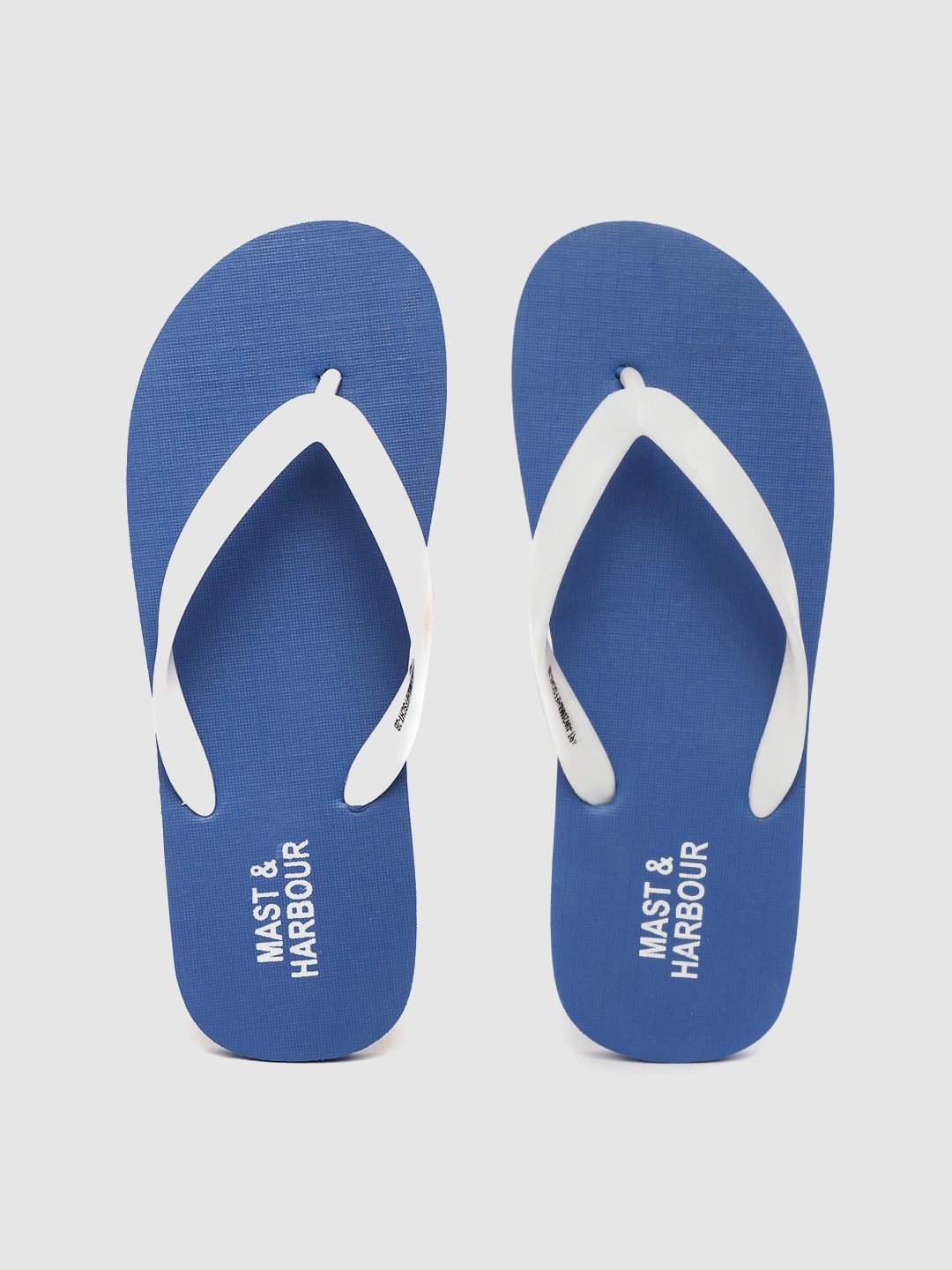 

Mast & Harbour Men White & Blue Solid Thong Flip-Flops