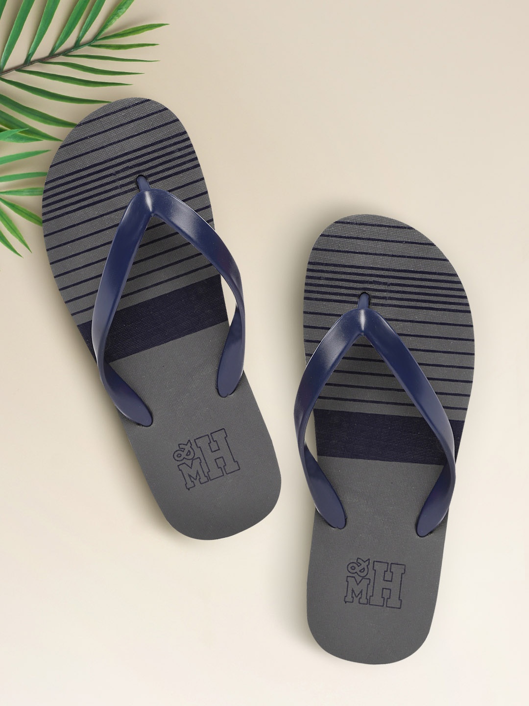 

Mast & Harbour Men Navy Blue & Grey Striped Thong Flip-Flops
