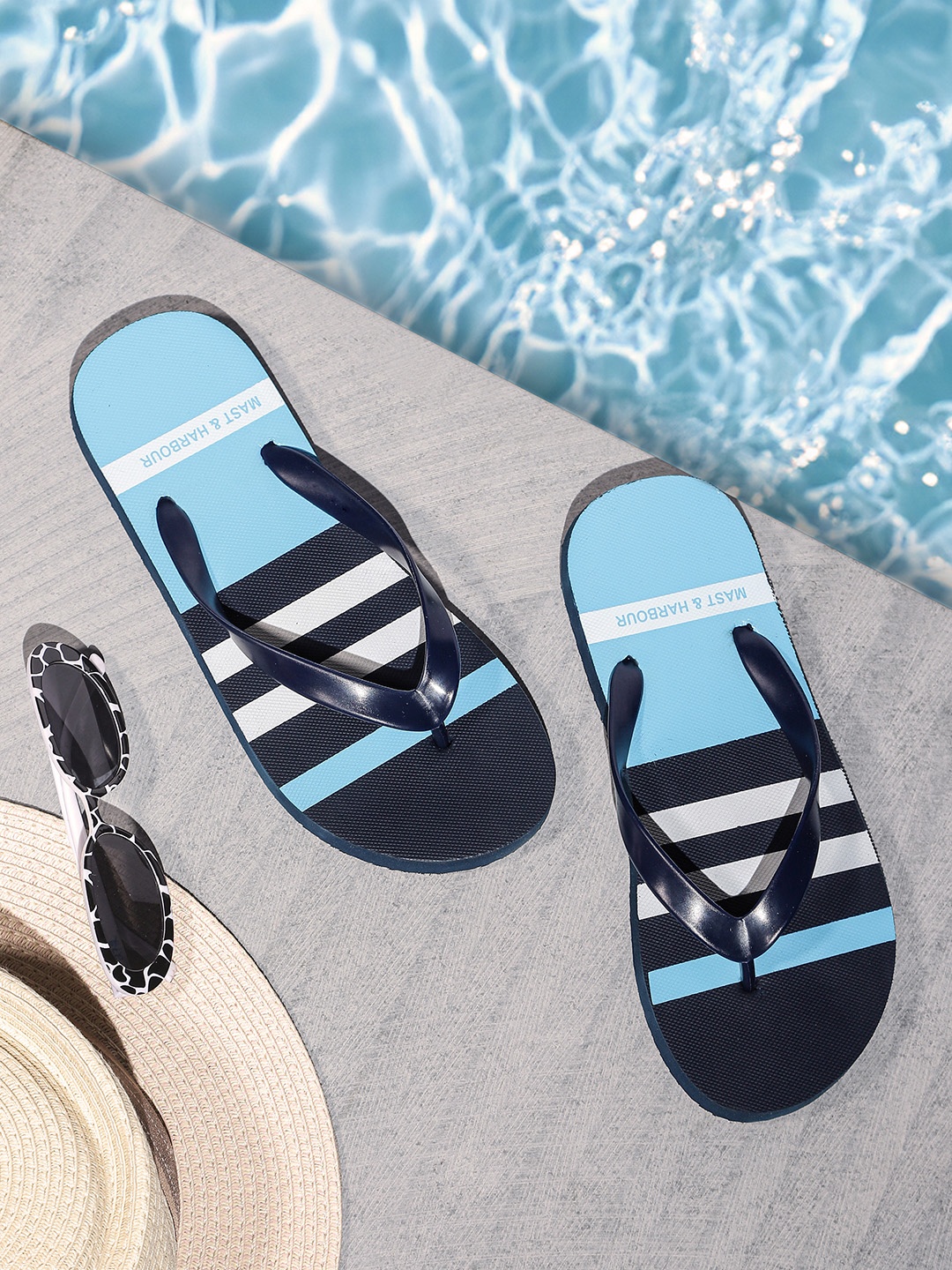 

Mast & Harbour Men Navy Blue & White Striped Thong Flip-Flops