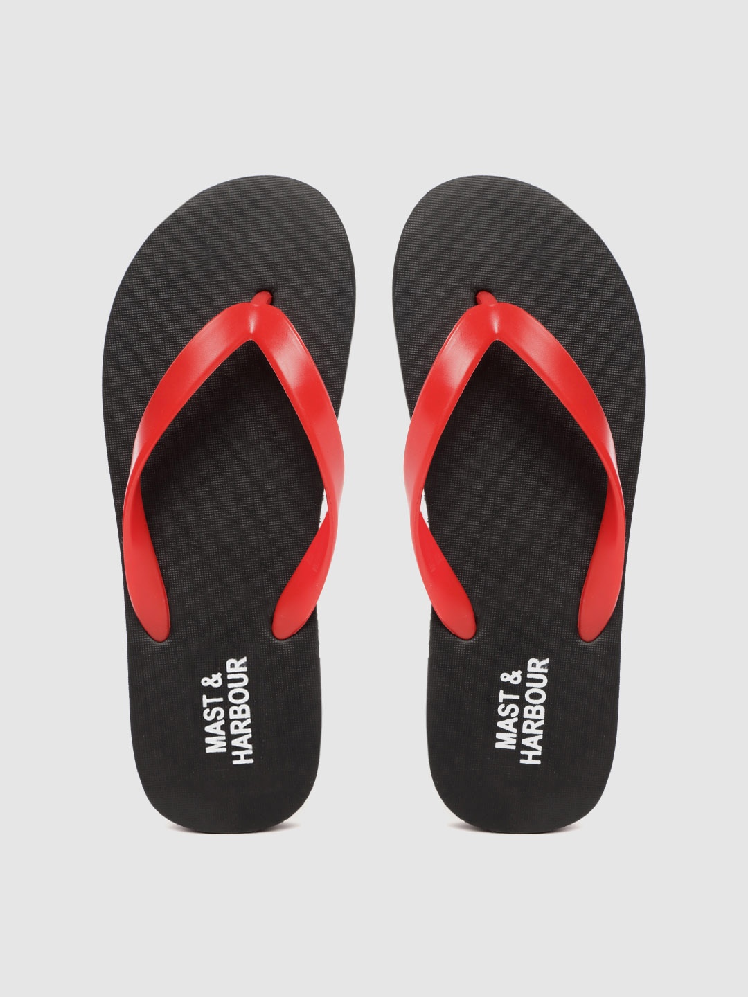 

Mast & Harbour Men Red & Black Solid Thong Flip-Flops