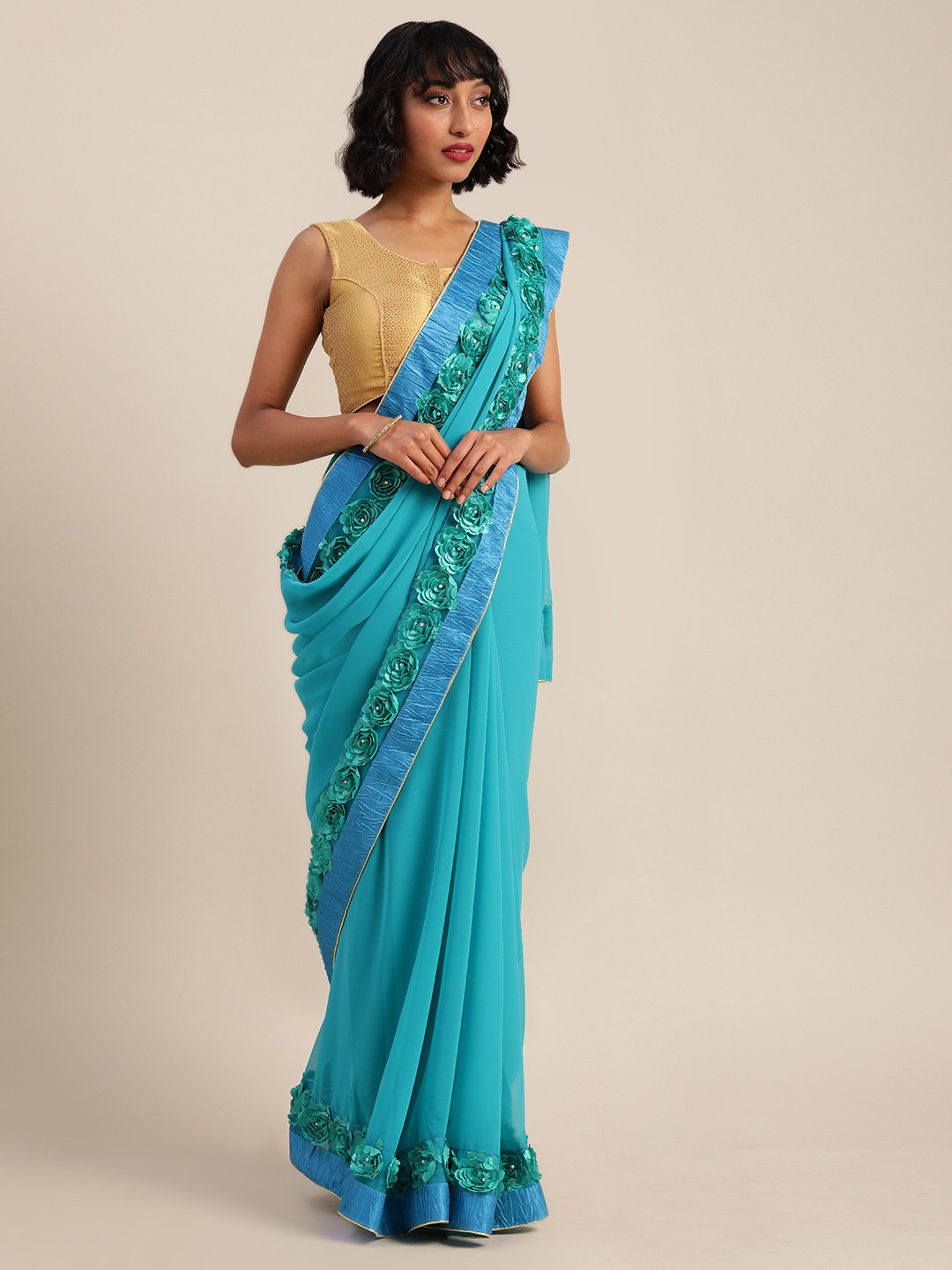 

Mitera Turquoise Blue Solid Pure Georgette Saree with Embellishments