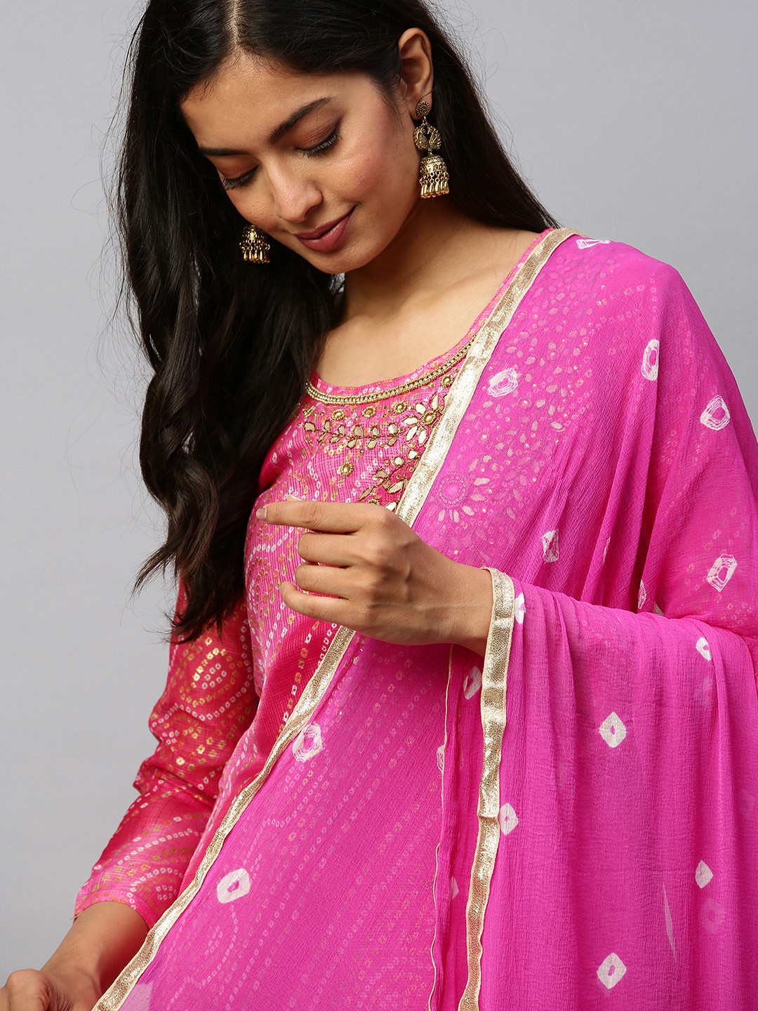 

Rajnandini Pink & White Cotton Blend Bandhani Printed Unstitched Dress Material