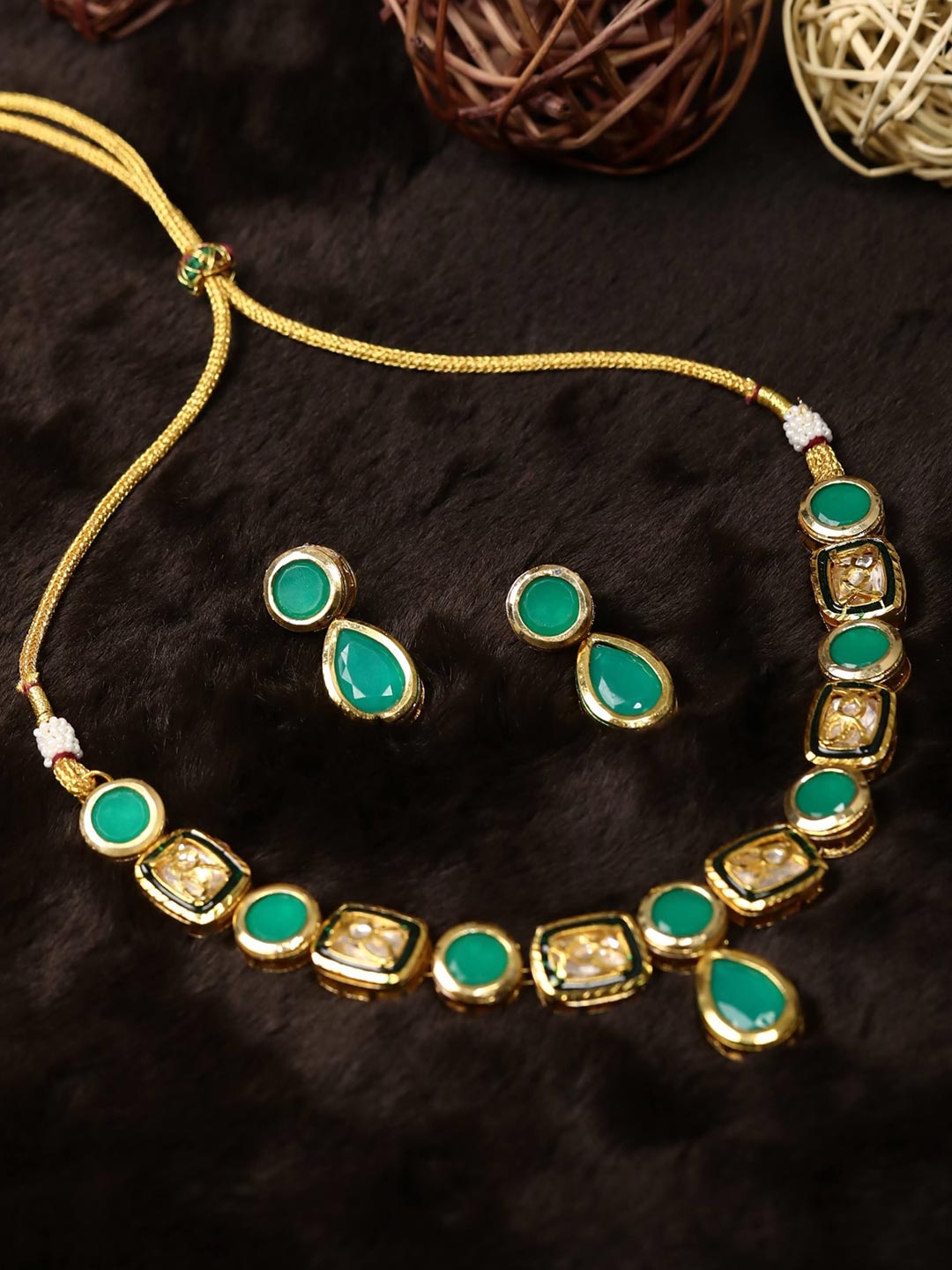 

Priyaasi Green Gold-Plated Artificial Stone Studded Handcrafted Jewellery Set