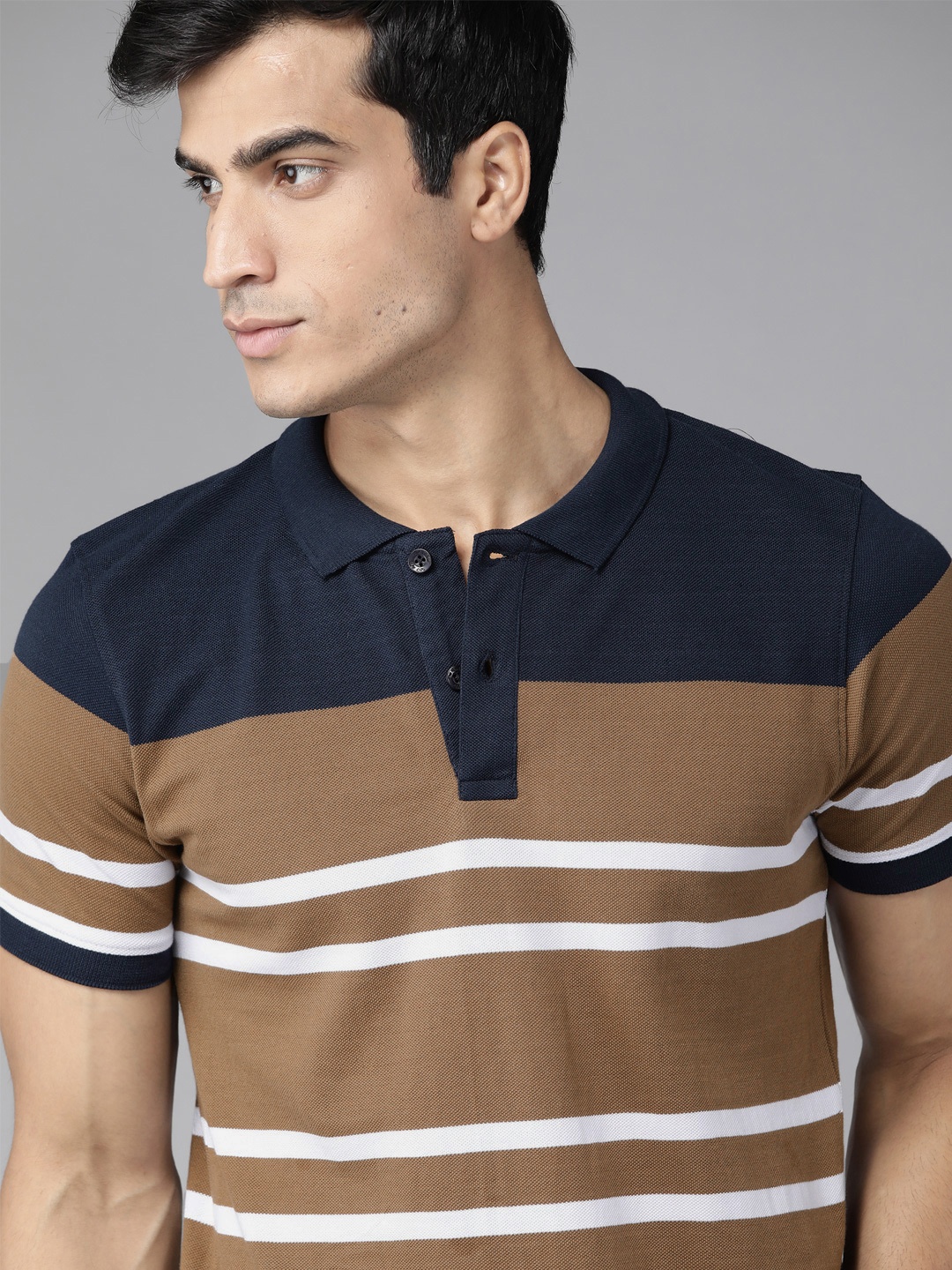 

Roadster Men Beige Pure Cotton Striped Polo Collar T-shirt
