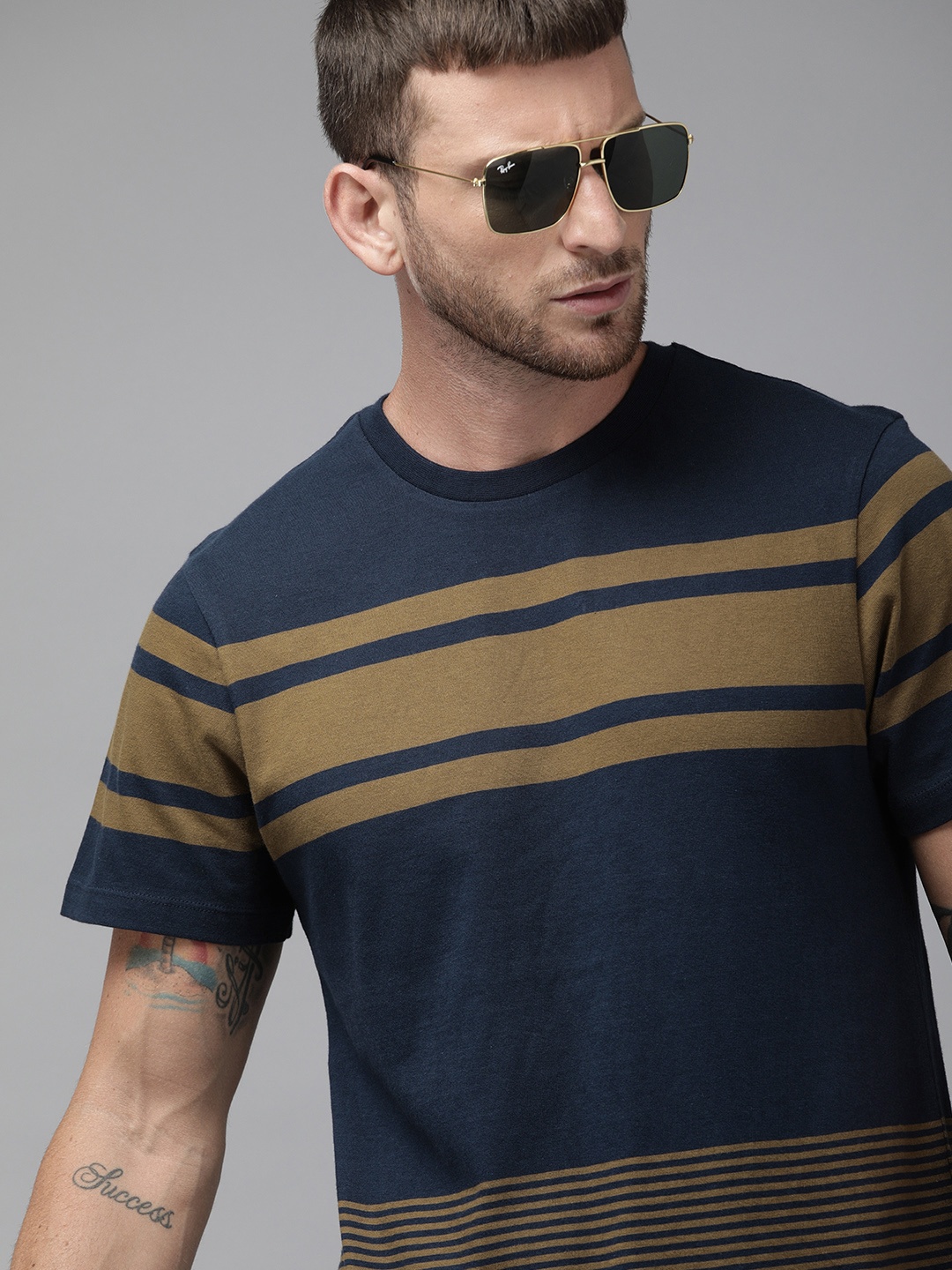 

Roadster Men Navy Blue Brown Striped Round Neck Pure Cotton T-shirt