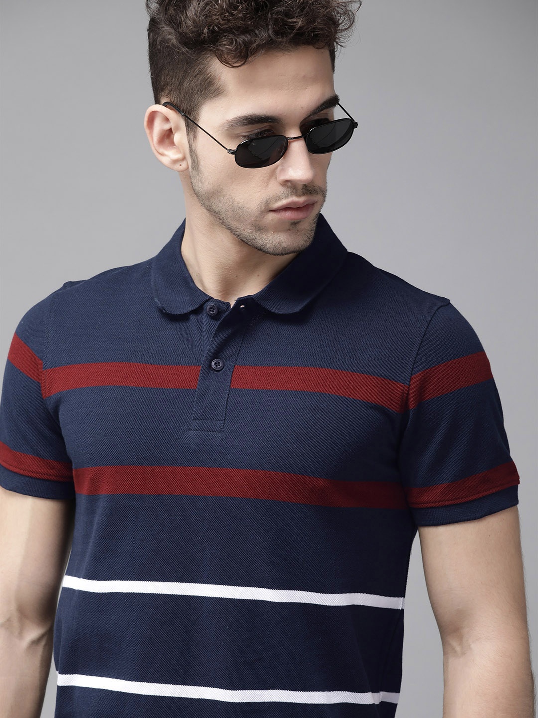 

Roadster Men Navy Blue Striped Pure Cotton Polo Collar Pure Cotton T-shirt