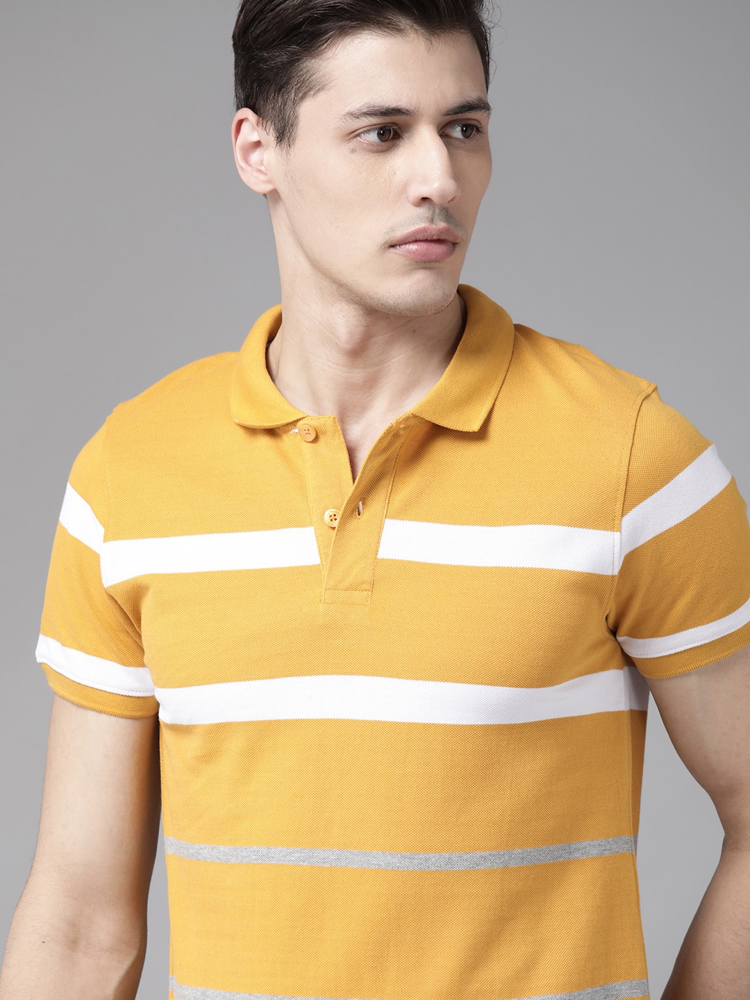 

Roadster Men Mustard Yellow & White Striped Polo Collar T-shirt