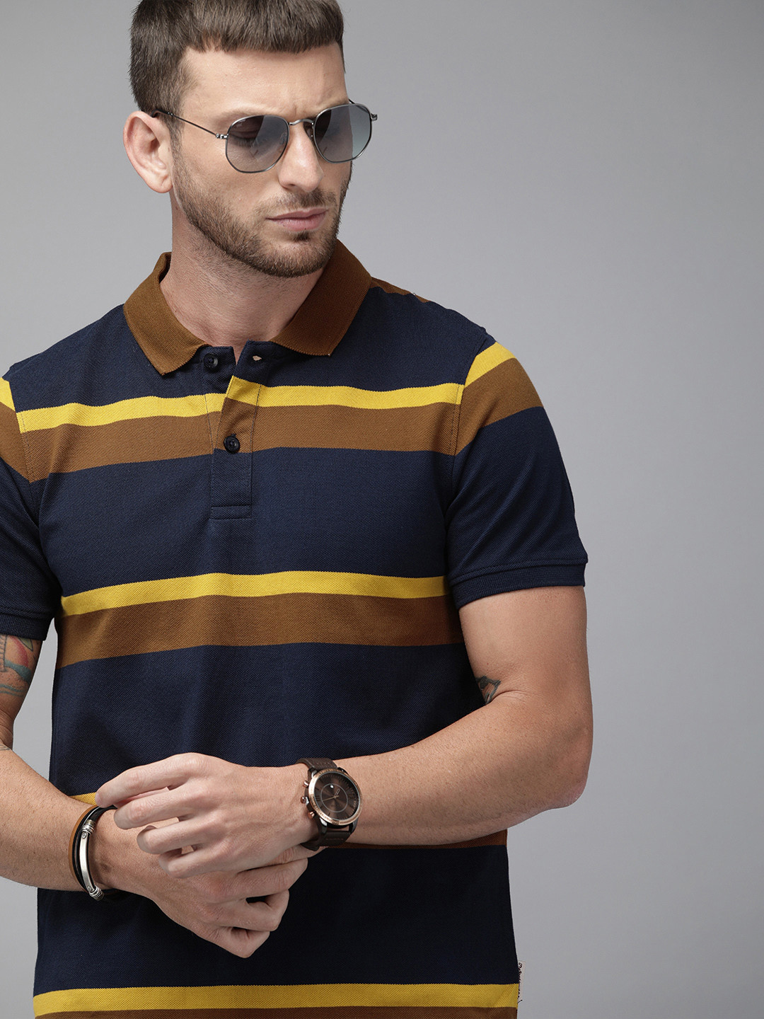 

Roadster Men Navy Blue Mustard Yellow Striped Polo Collar Pure Cotton T-shirt