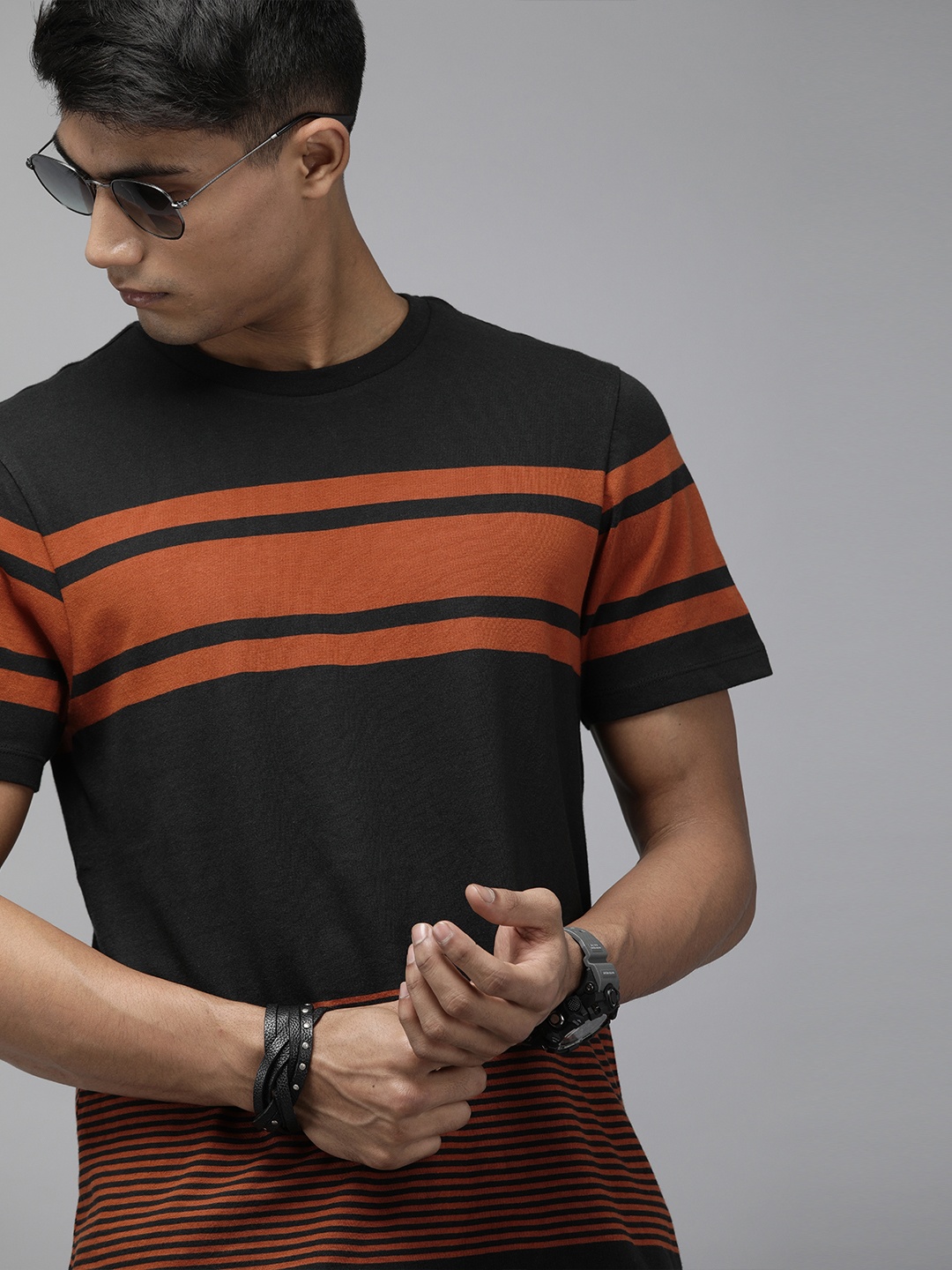 

Roadster Men Black Rust Orange Striped Round Neck Pure Cotton T-shirt