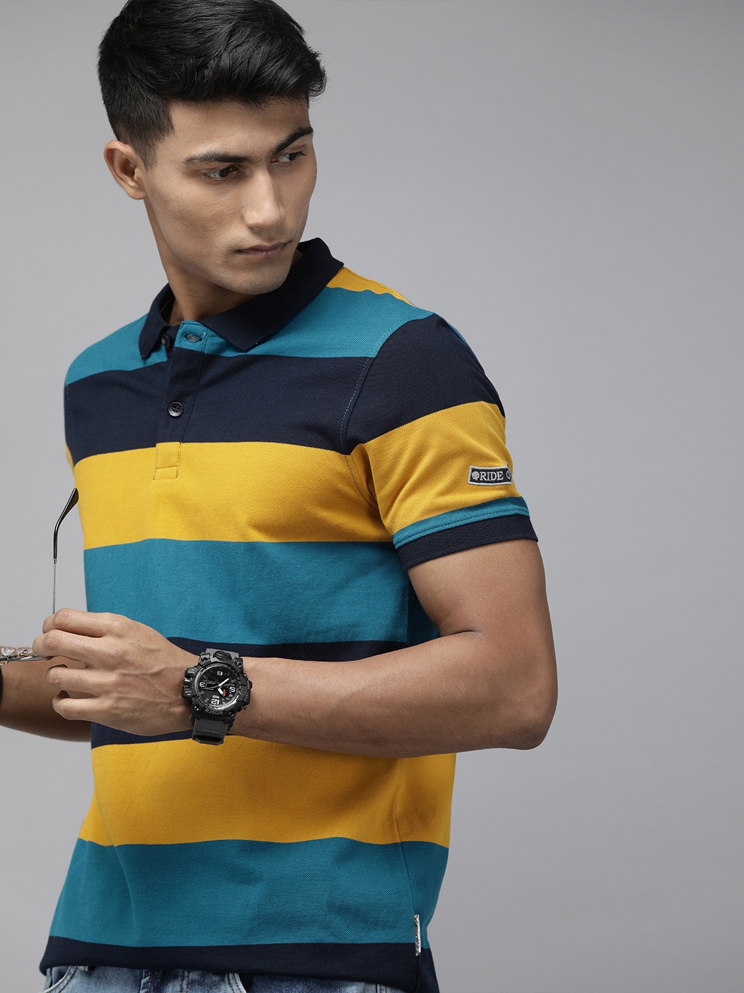 

Roadster Men Navy Blue Mustard Yellow Striped Polo Collar Pure Cotton T-shirt