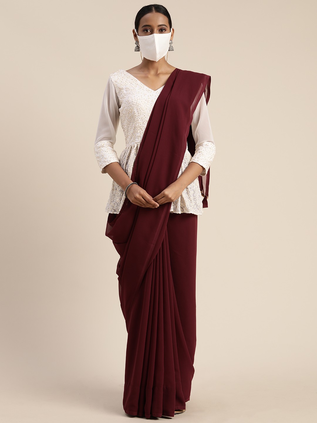 

Ethnovog Burgundy Solid Poly Georgette Saree With Matching Mask