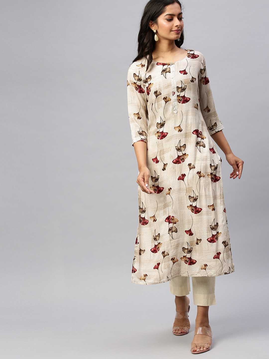 

Ishin Women Off-White & Brown Floral Printed Gotta Patti Straight Kurta