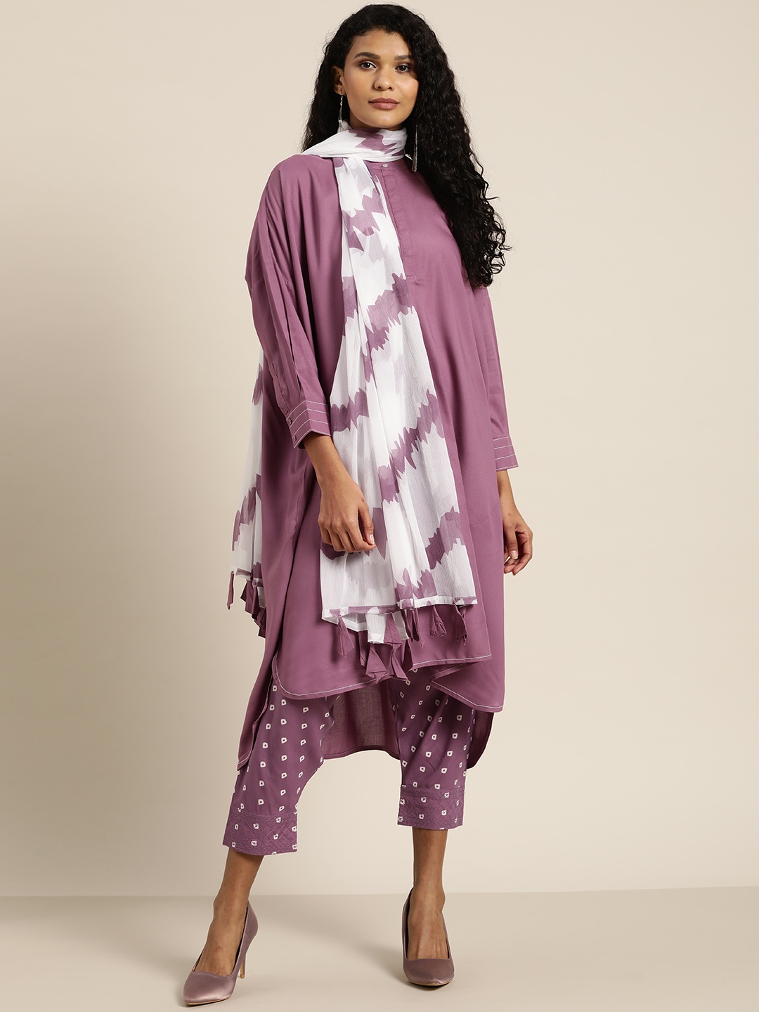 

Moda Rapido Women Purple & White Solid Kurta with Printed Salwar & Dupatta