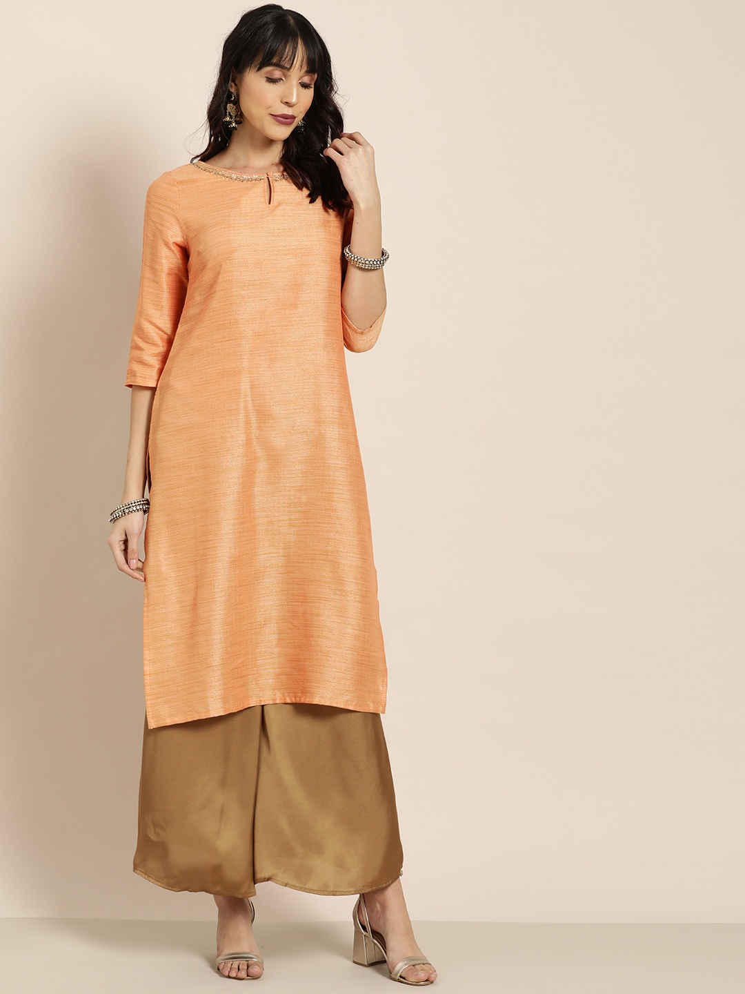 

Moda Rapido Women Orange & Gold-Toned Solid Straight Kurta With Embellished Detail