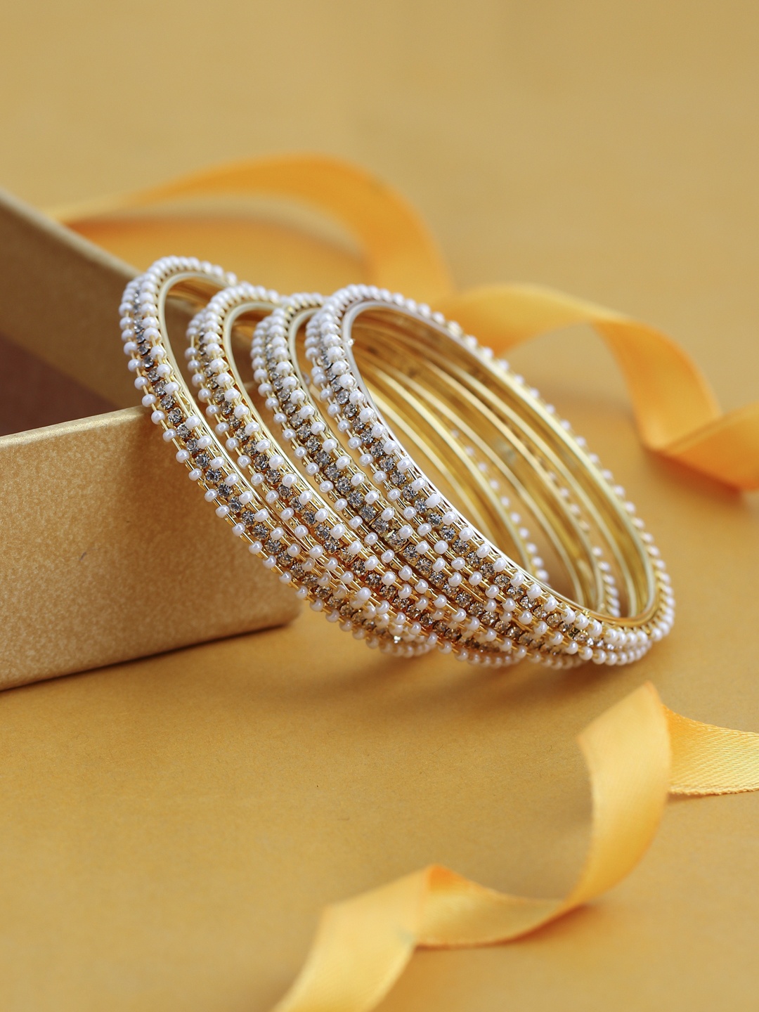 

Sukkhi Set Of 4 Gold-Plated White Austrian Diamond-Studded Pearl Bangles